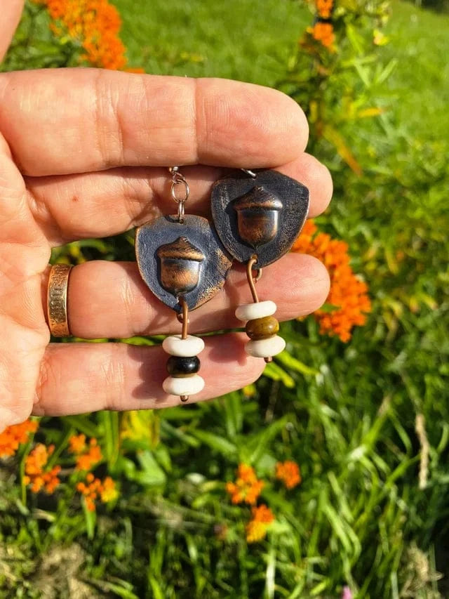Acorns4You earrings with acorn charm and beads, held in hand