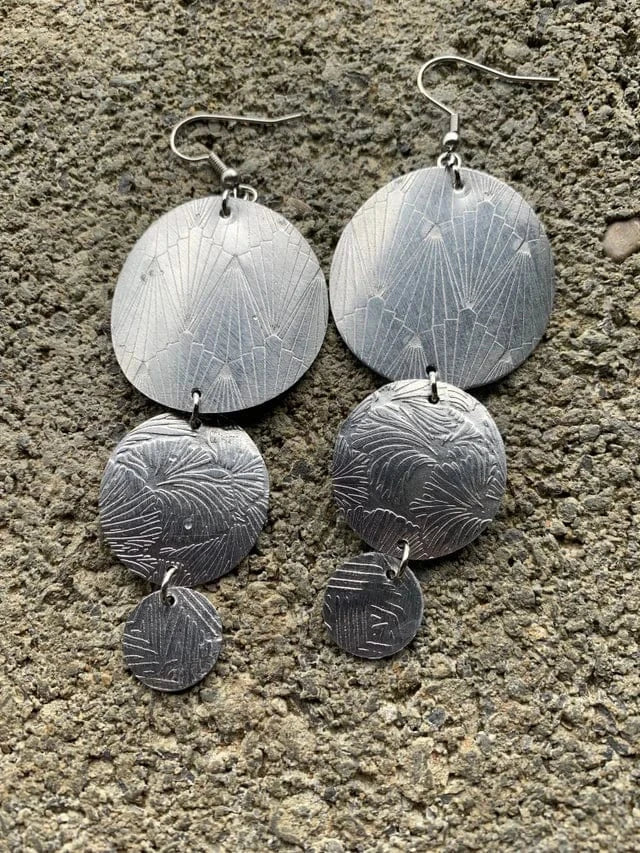 Silver earrings with flower and line pattern