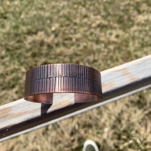 Copper bracelet with etched frequency pattern