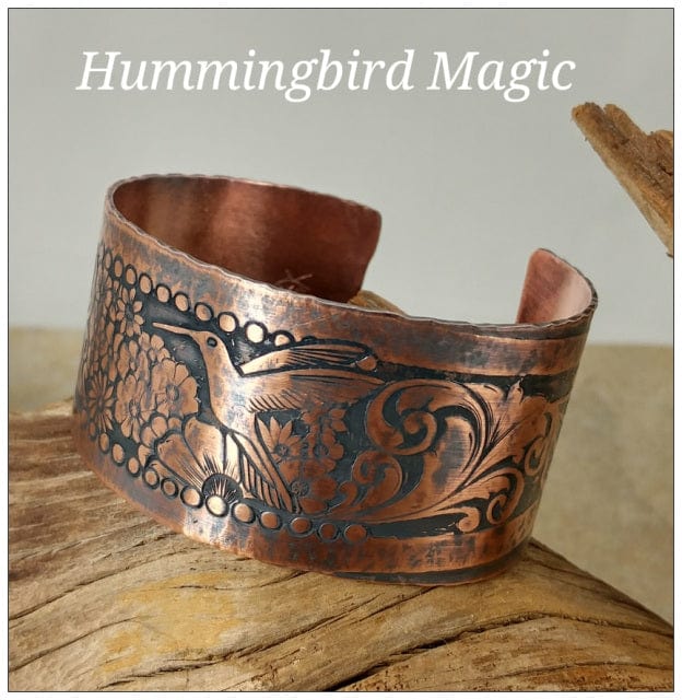 Hummingbird copper cuff bracelet with floral design