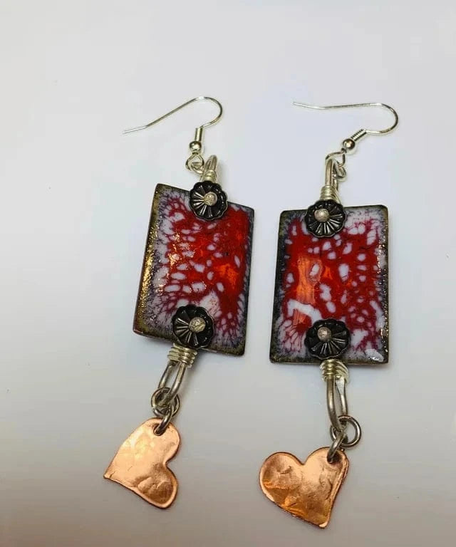 Copper heart earrings with red and white enamel.