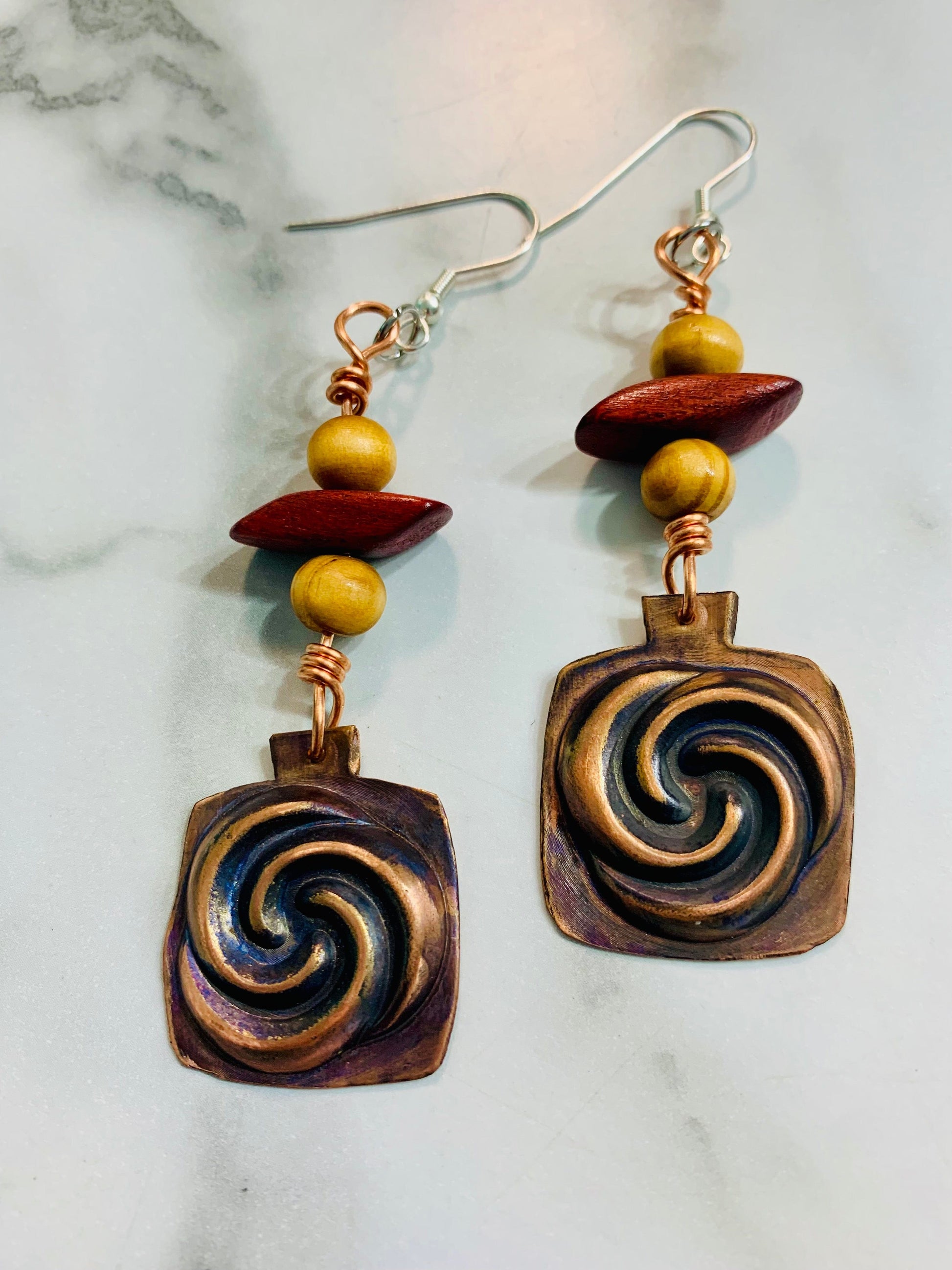 MindSwirls1 earrings with copper swirls and wood beads.