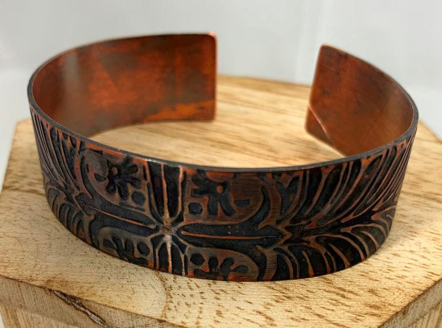 Narrow Lucky copper bracelet with floral design