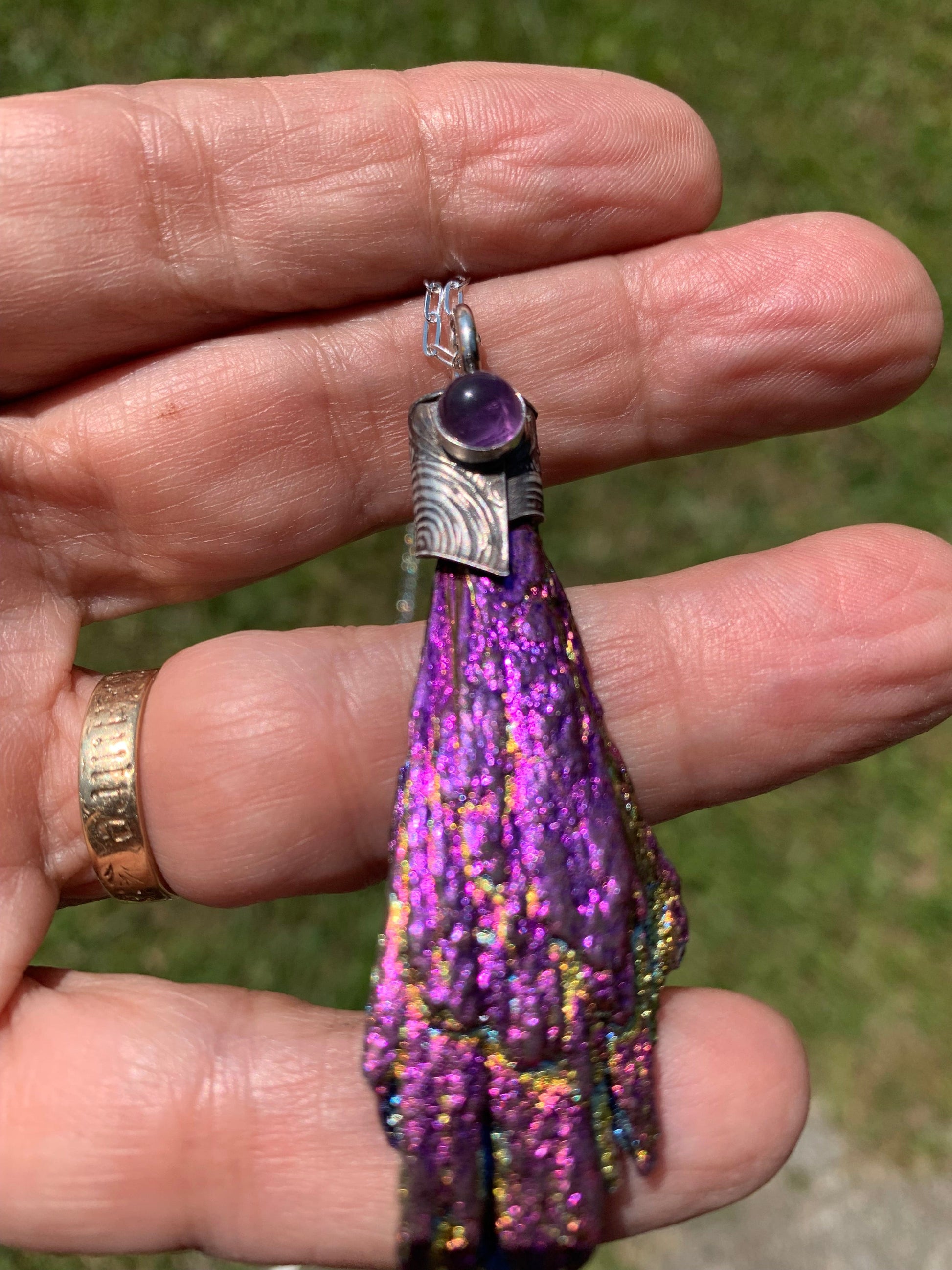 Purple Amethyst pendant necklace in hand