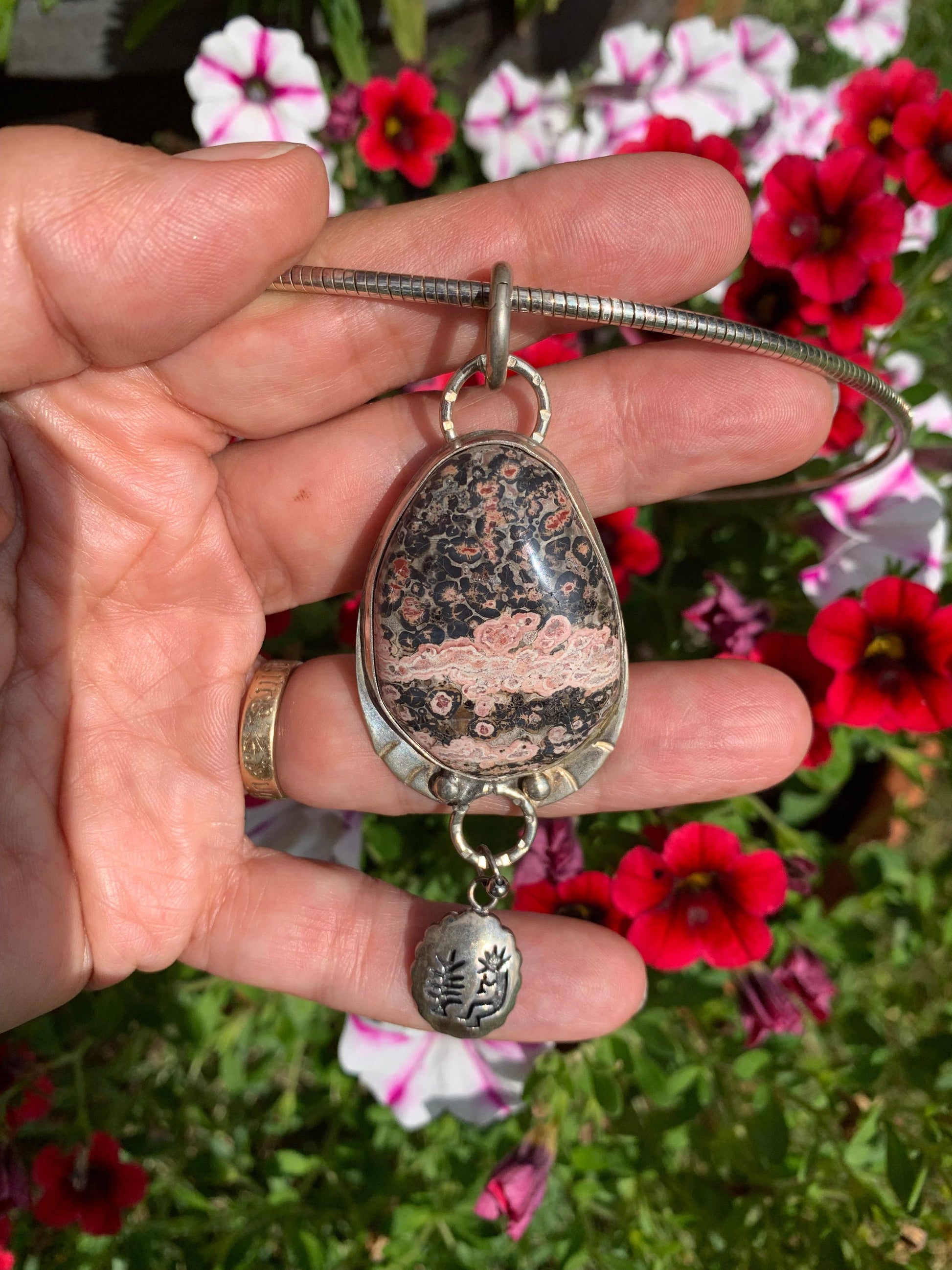 SandyBottom1 pendant with stone and floral background