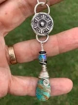 Sea Sediment Peace pendant necklace with silver details