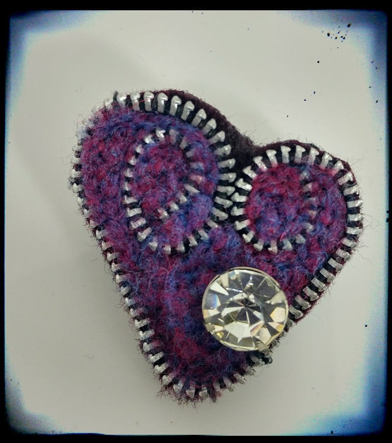 Purple heart brooch with zipper trim and jewel
