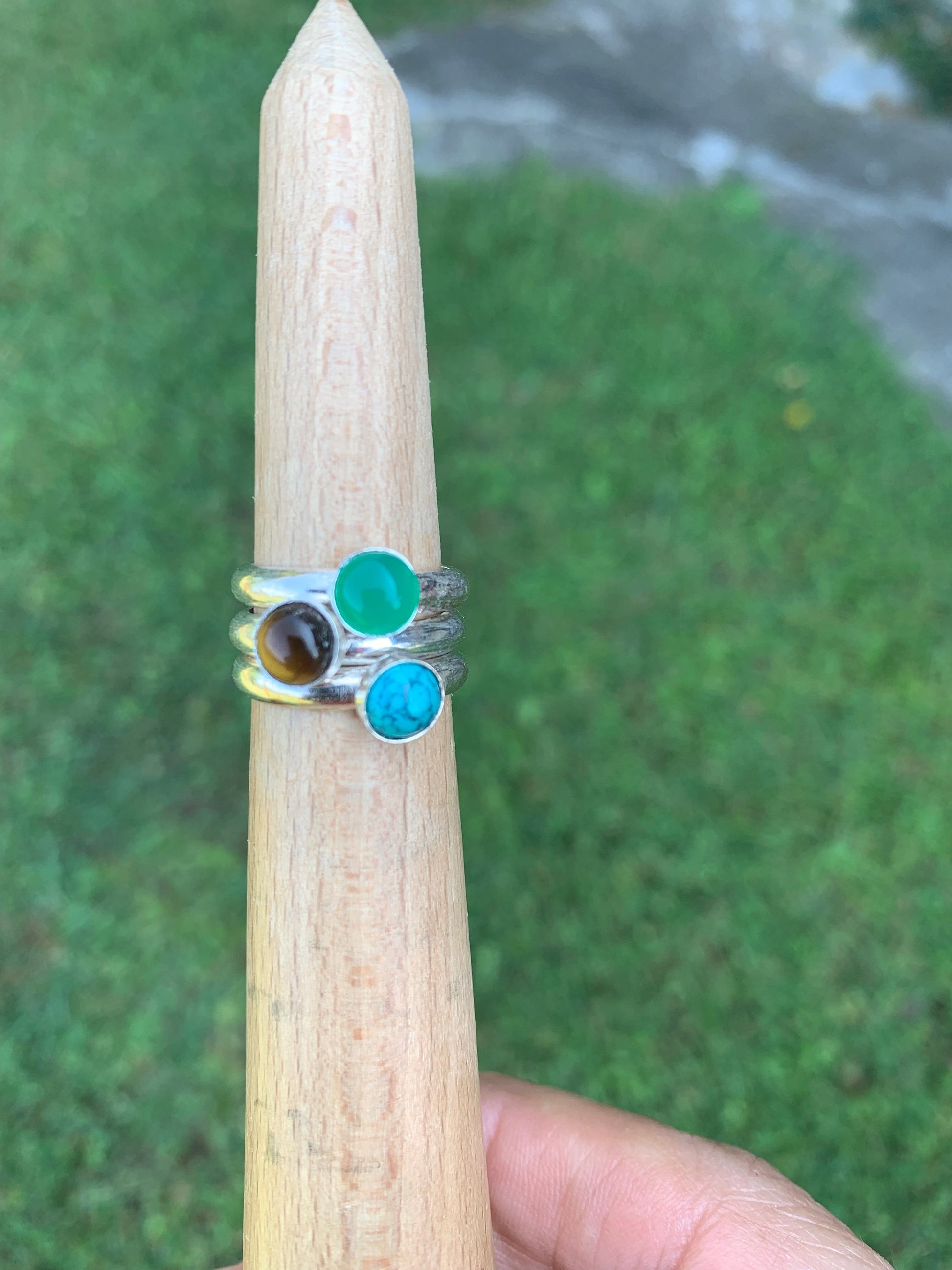 Stacker 5 1/2 rings with green, blue, and brown stones
