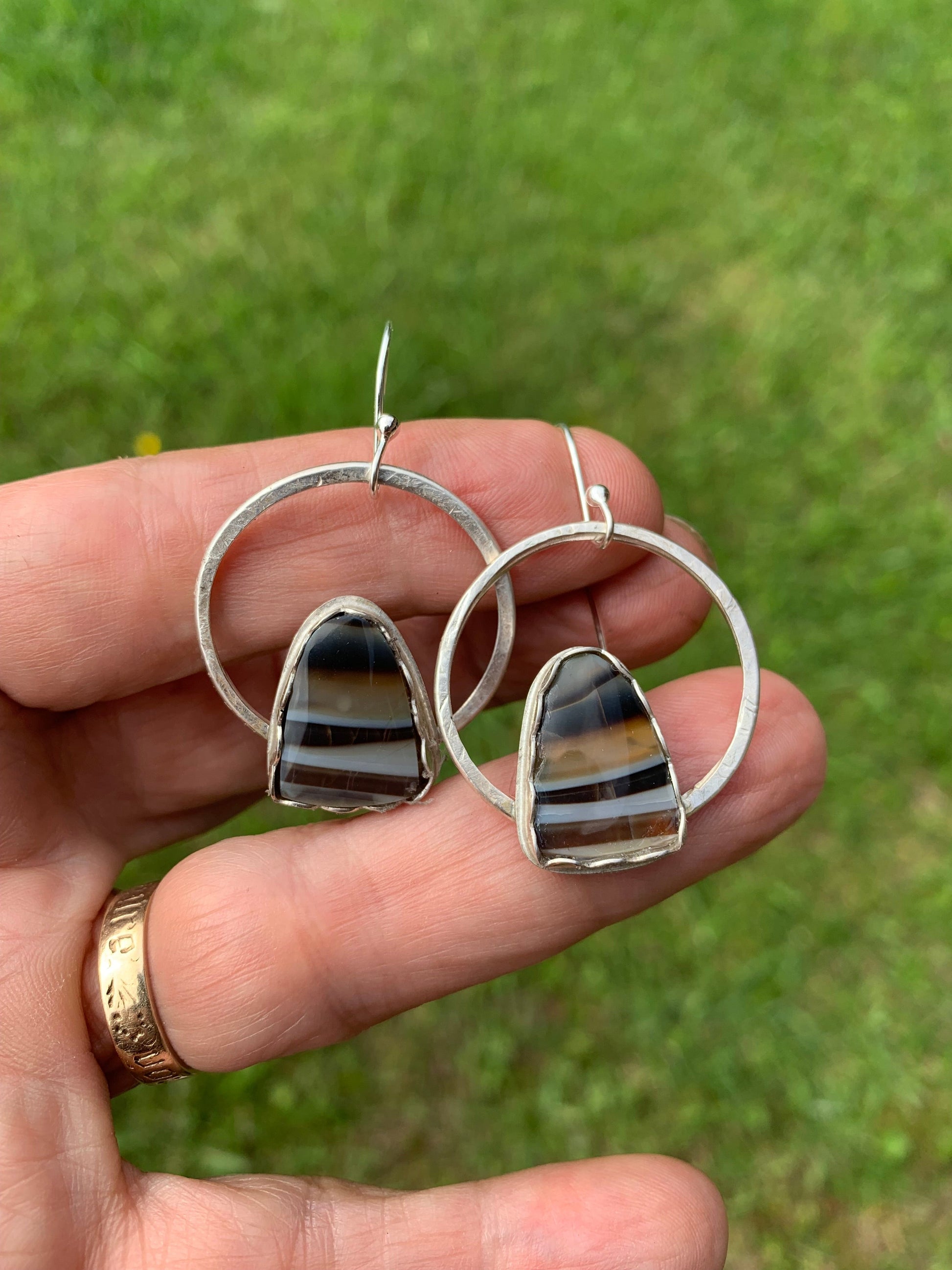 Banded brown agate earrings on silver hoops