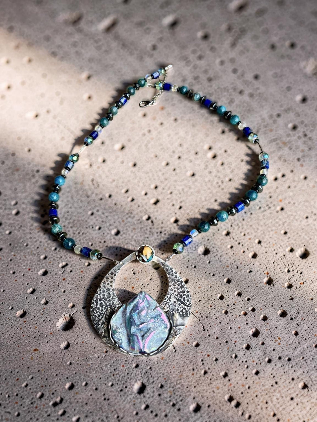 Alpenglow one-of-a-kind Titanium Coquina sterling silver statement necklace by jewelry artist Christine Keller