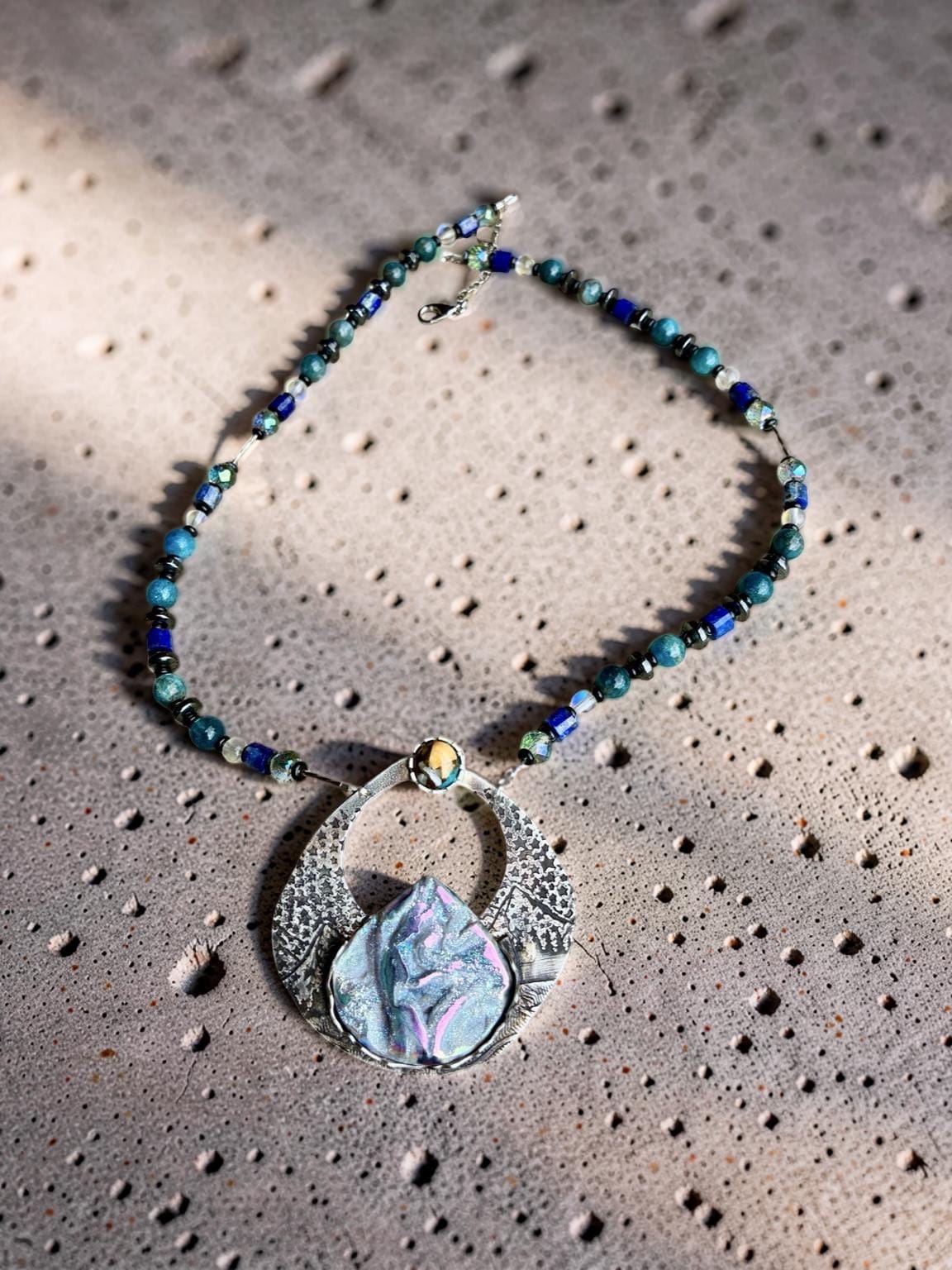 Alpenglow one-of-a-kind Titanium Coquina sterling silver statement necklace by jewelry artist Christine Keller