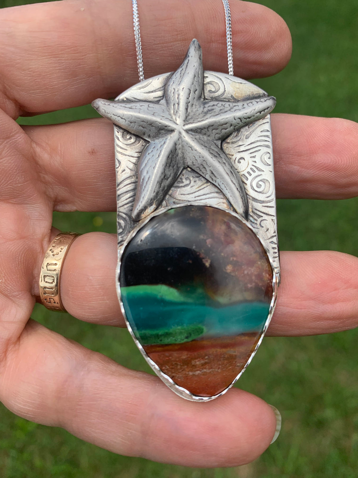 One-of-a-kind Bluewood Opal Jasper pendant with handcrafted sterling silver starfish and ocean-inspired texture