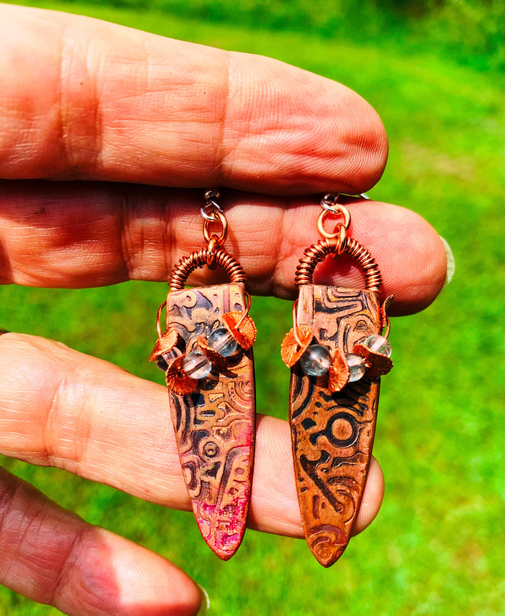 Apatite copper flake earrings held in hand