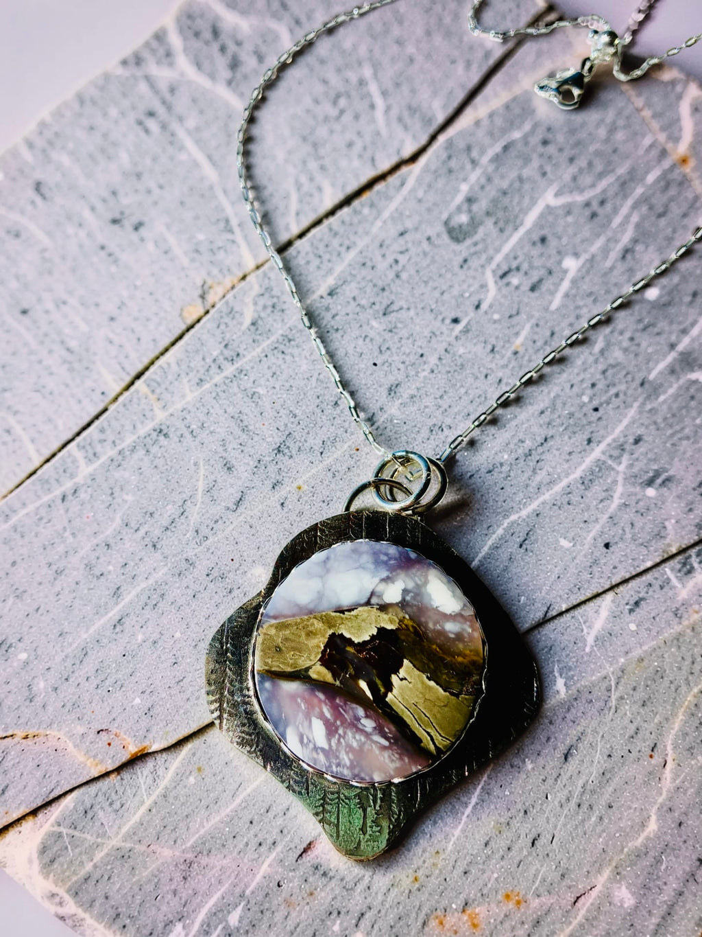 At the Edge of Forever purple scenic chalcedony pendant in hand-textured sterling silver by Christine Keller, on an adjustable silver chain.