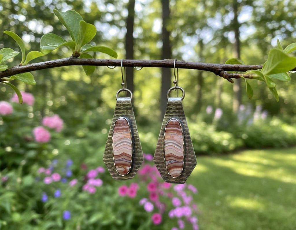 One-of-a-kind sterling silver earrings featuring elongated earth-tone Banded Crazy Lace Agate stones in hand-textured silver settings with handcrafted earwires.