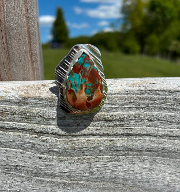  One-of-a-kind sterling silver ring featuring a rare Blue Wood Opal with turquoise blue and earthy red tones, handcrafted by Christine Keller in size 7.