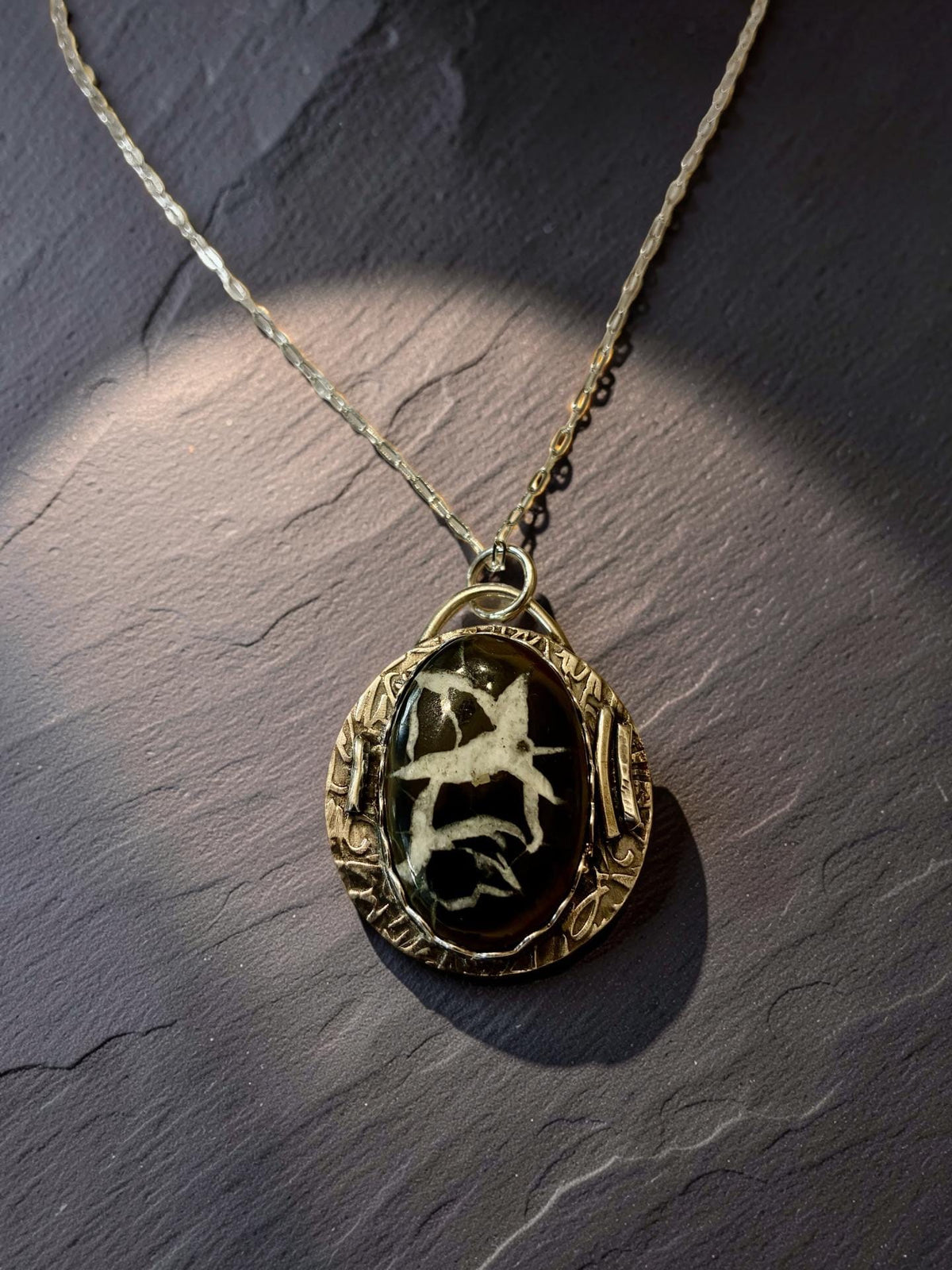 White Heron one-of-a-kind Septarian pendant handcrafted in sterling silver on a 24-inch adjustable silver chain.