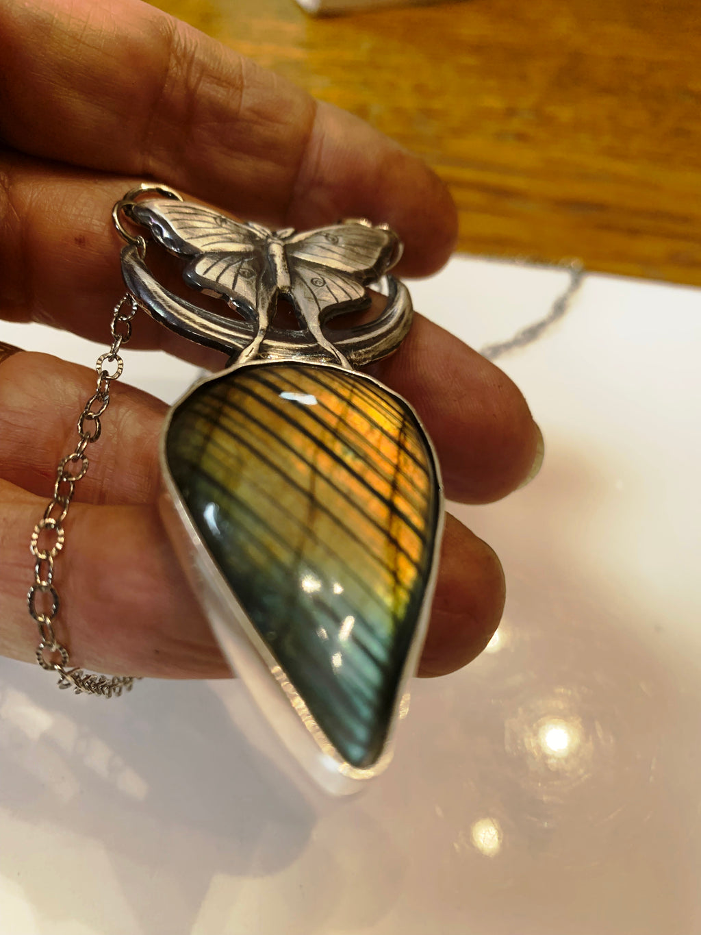 Close-up of Magical Moments Labradorite pendant with handcrafted sterling silver butterfly and crescen