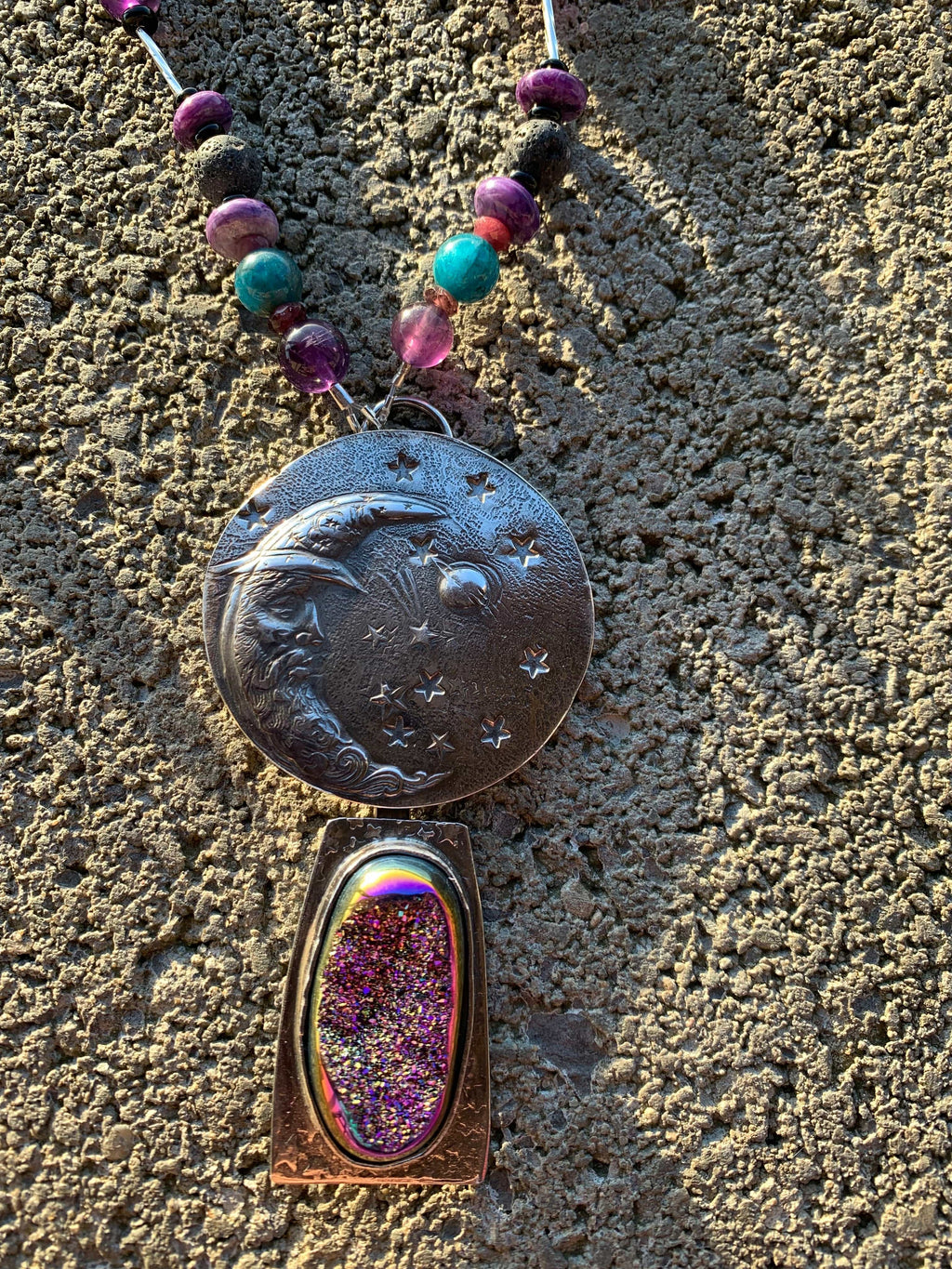 Man in the moon silver pendant with stars on handcrafted chain on gray background