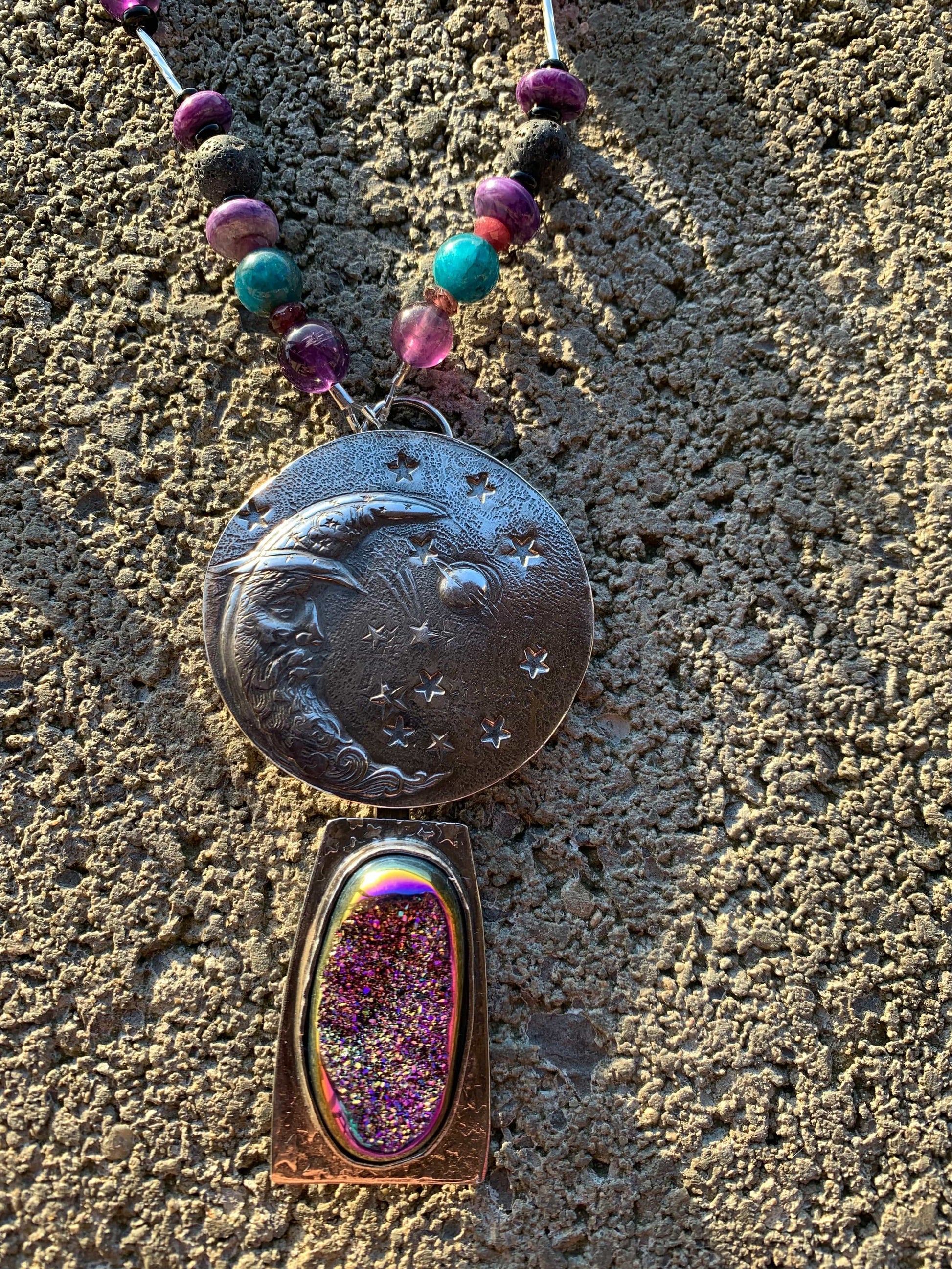Man in the moon silver pendant with stars on handcrafted chain on gray background