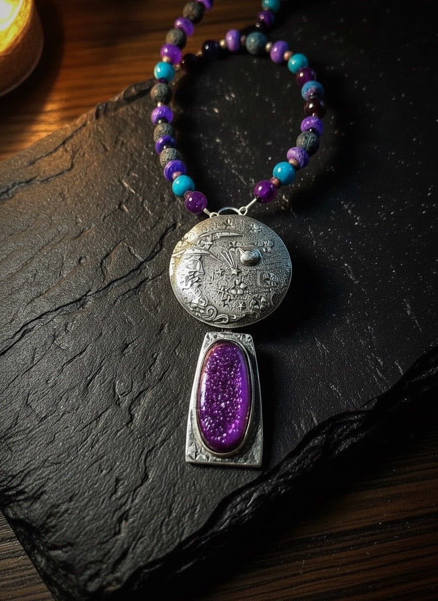 Necklace with a silver pendant featuring a purple stone on a dark surface
