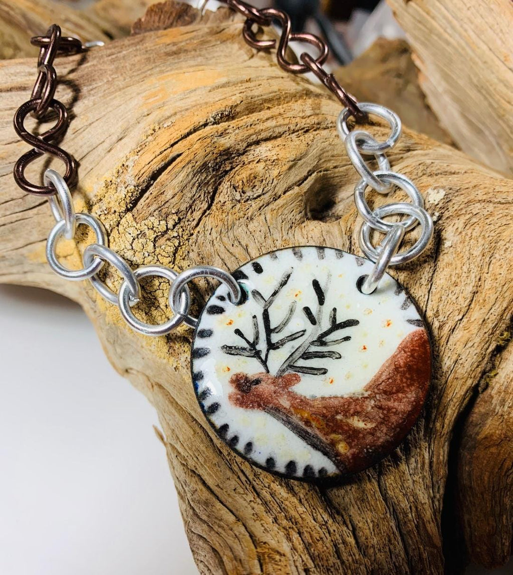 ELK enamel pendant necklace on driftwood