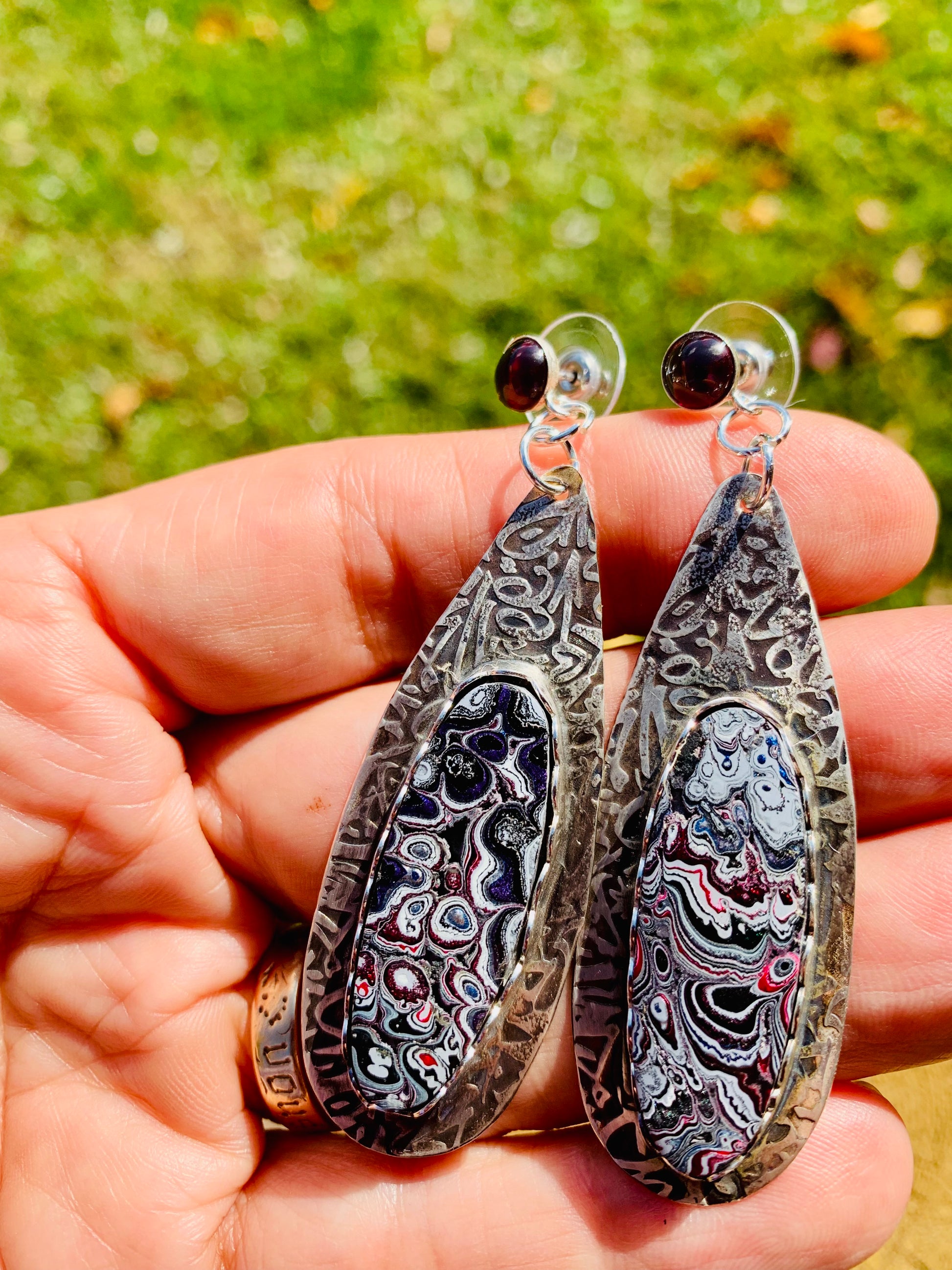 pink and black fordite silver earrings