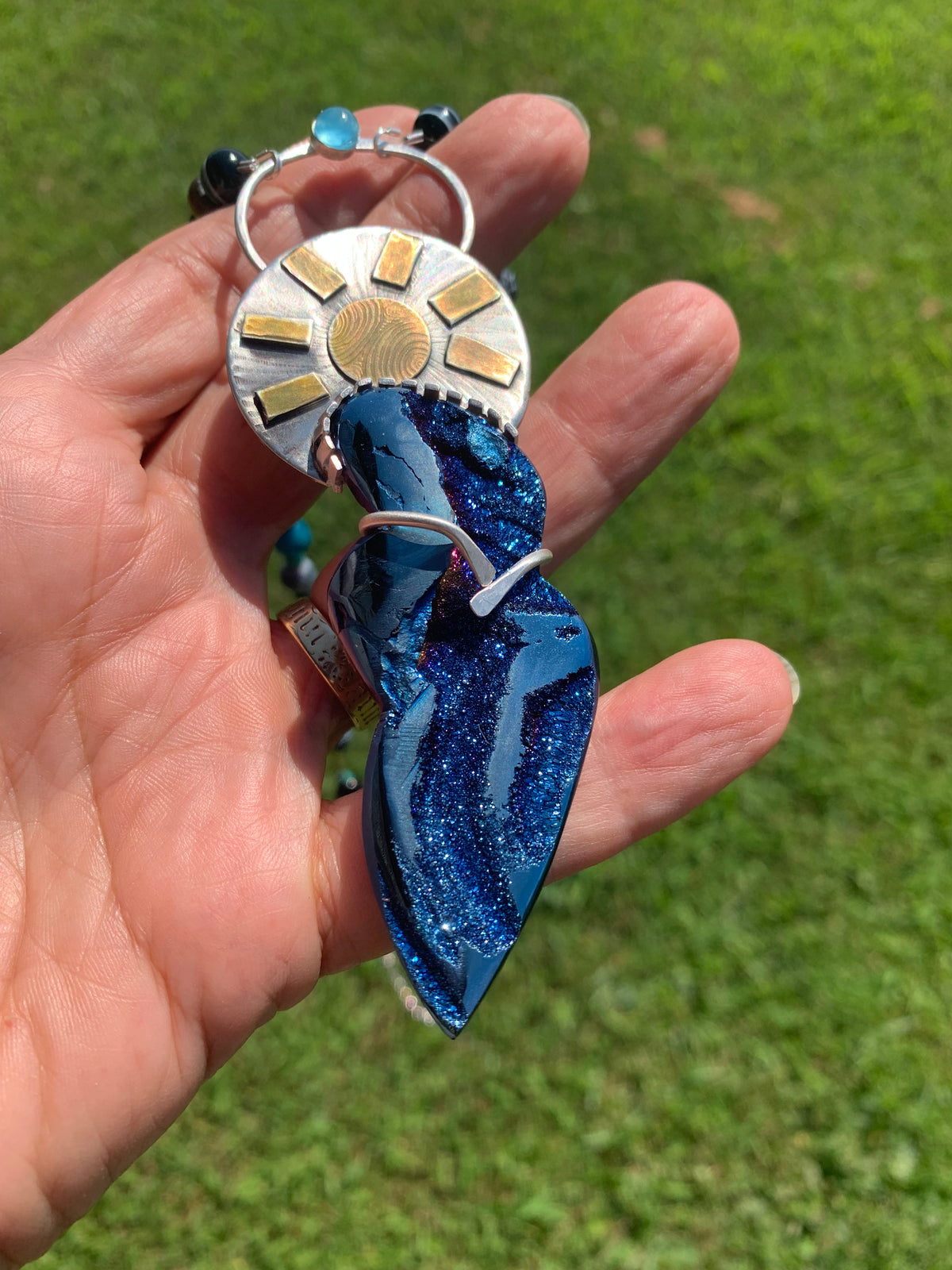 Goddess Pendant Necklace with Sunburst and Blue Stone