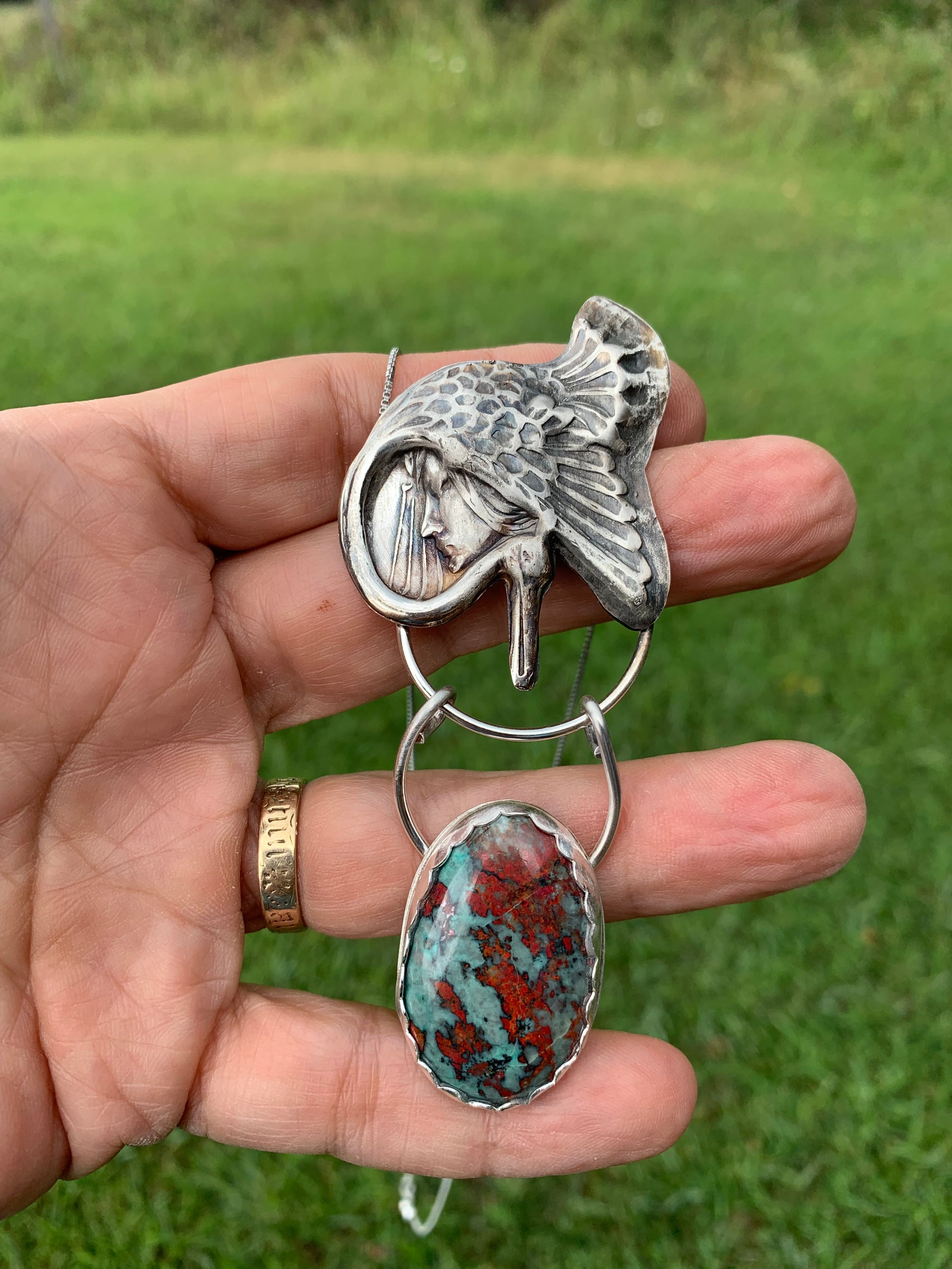 Goddess Under Wing pendant necklace with turquoise and silver.