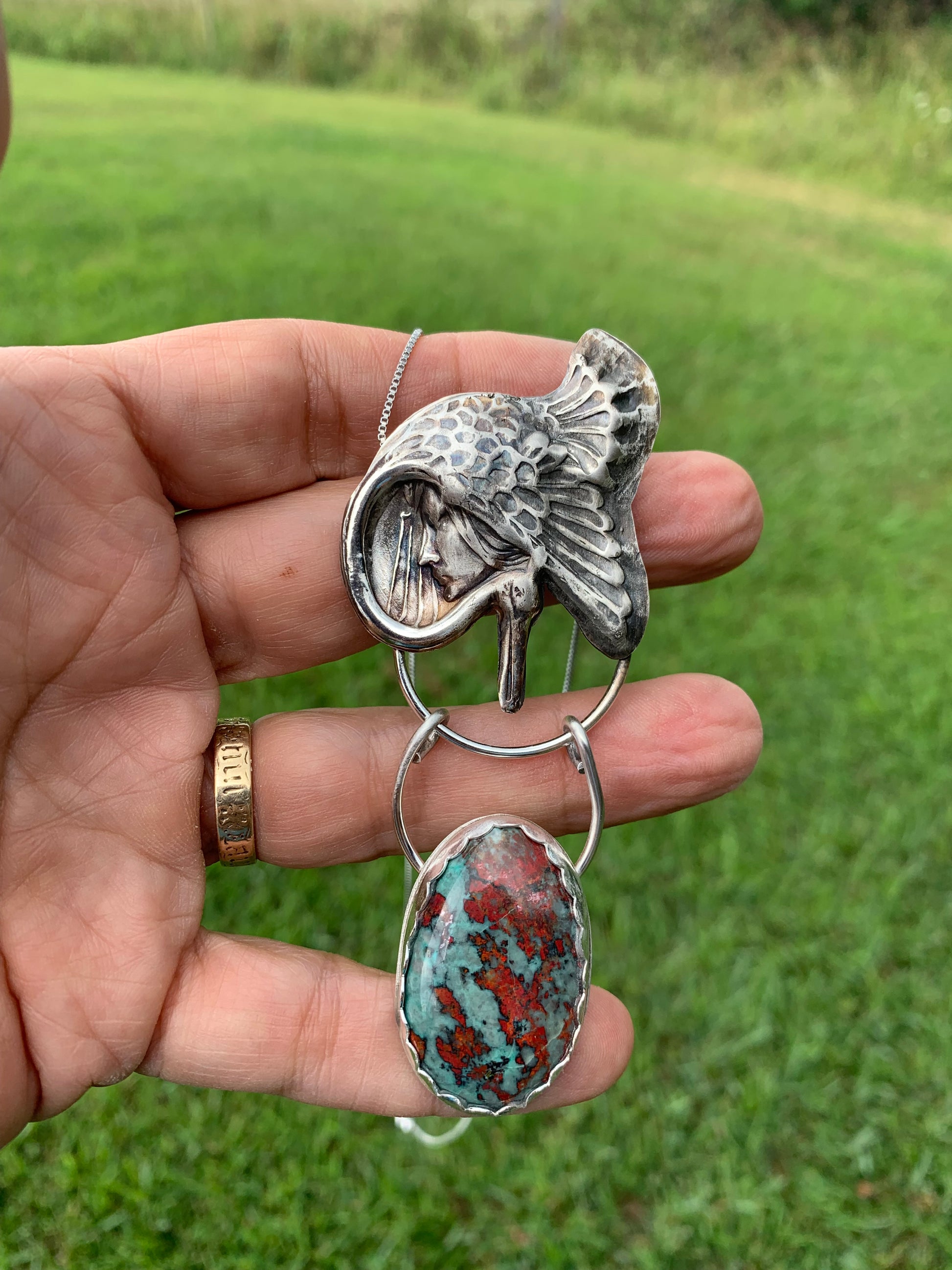Goddess Under Wing pendant with turquoise stone
