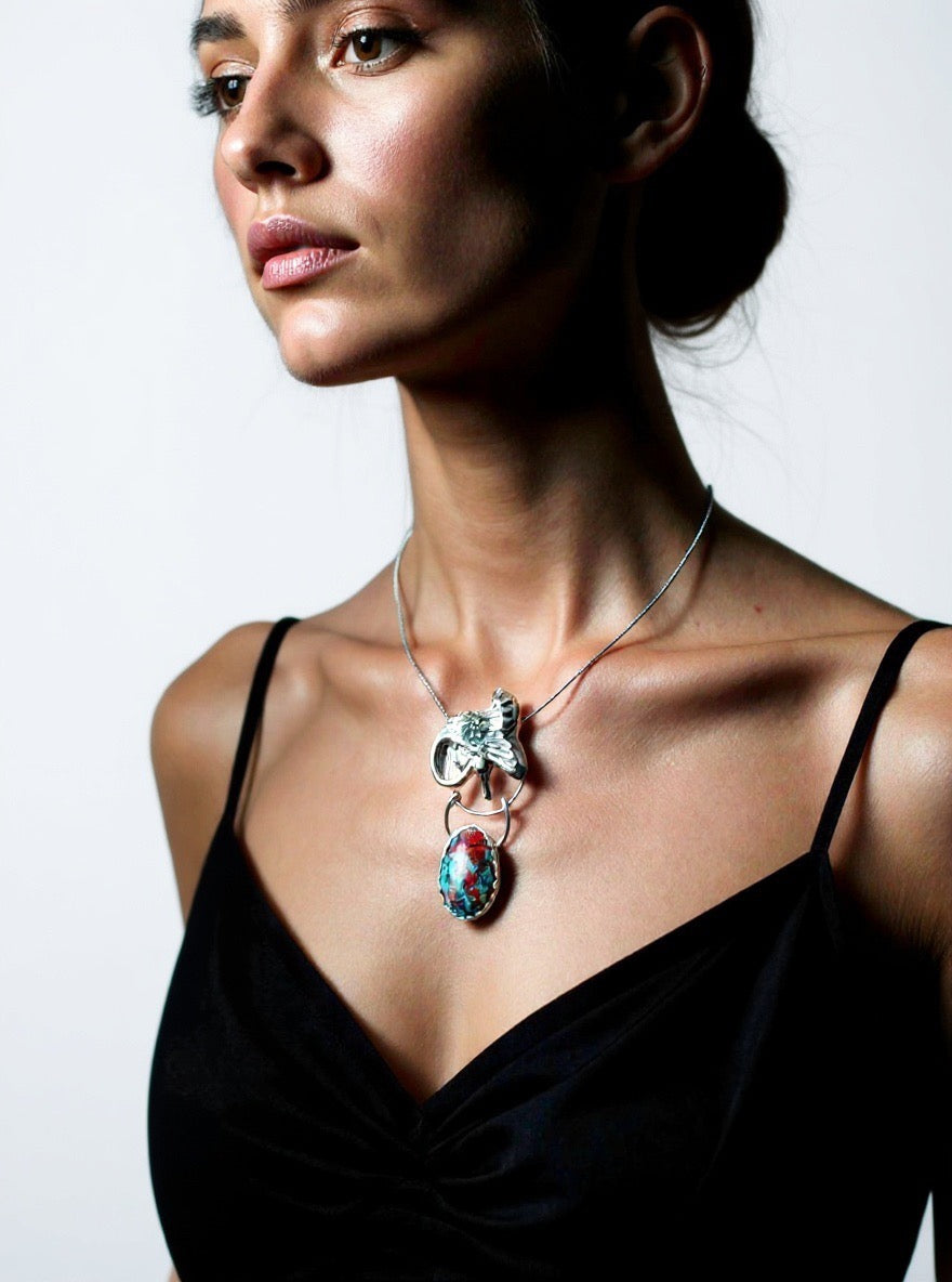 Goddess Under Wing necklace on woman