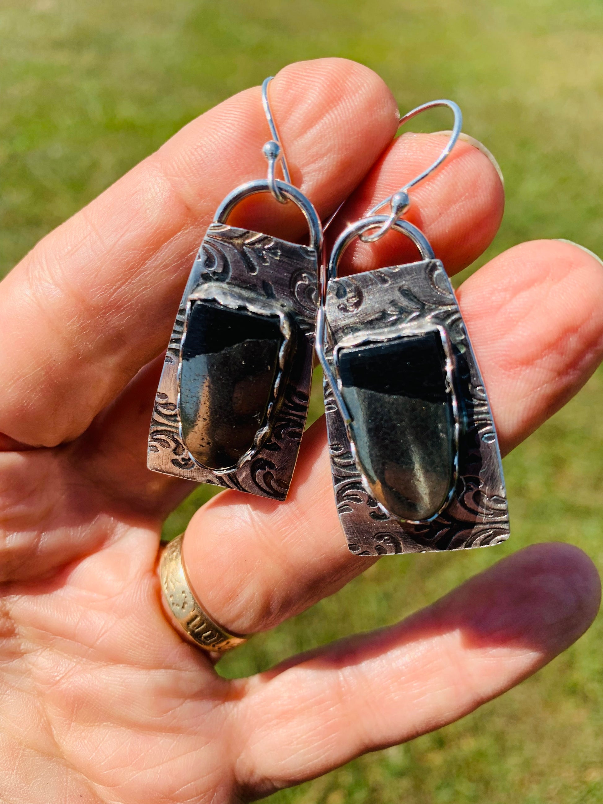Hematite earrings in hand