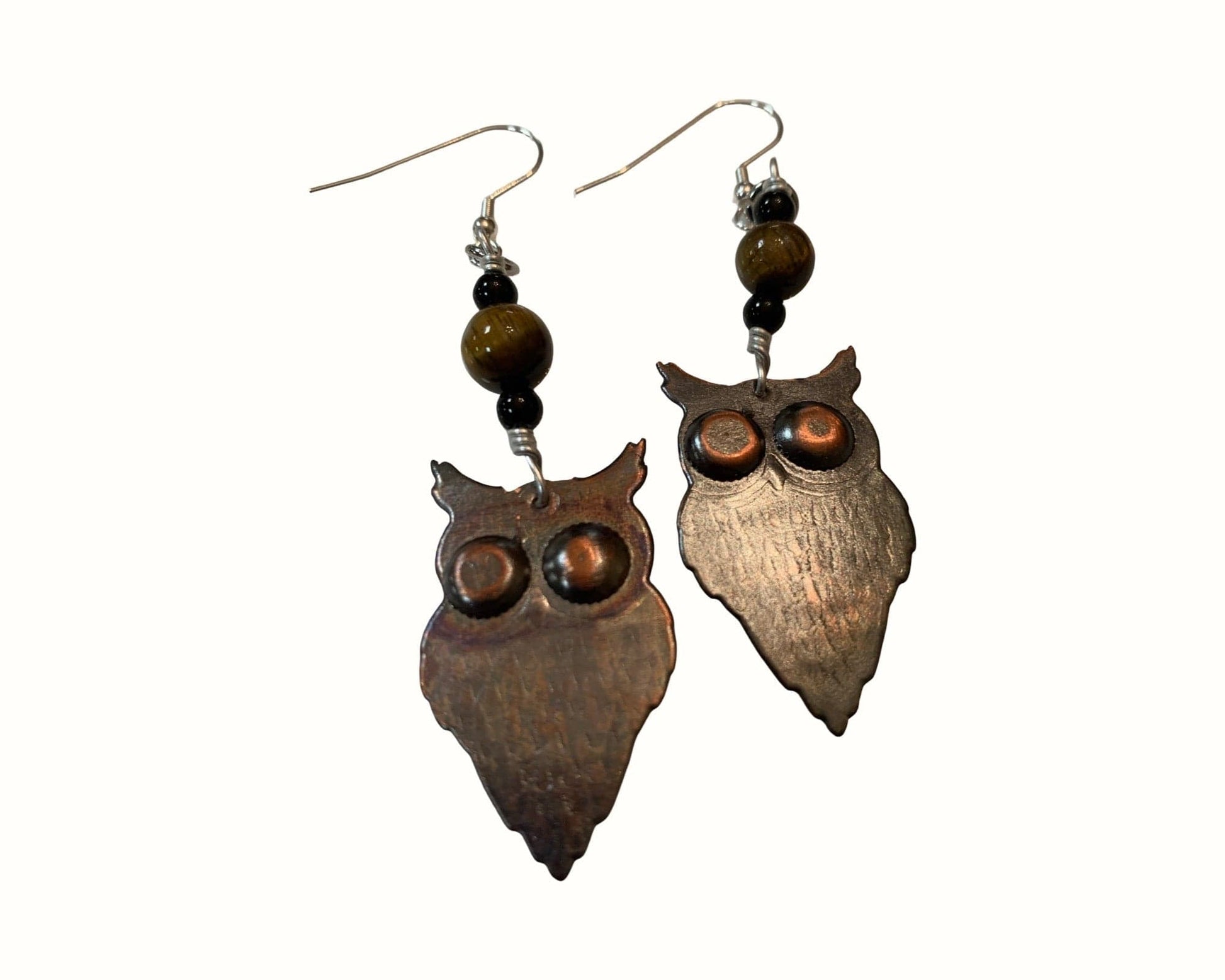 Owl-shaped earrings with brown beads on a white background
