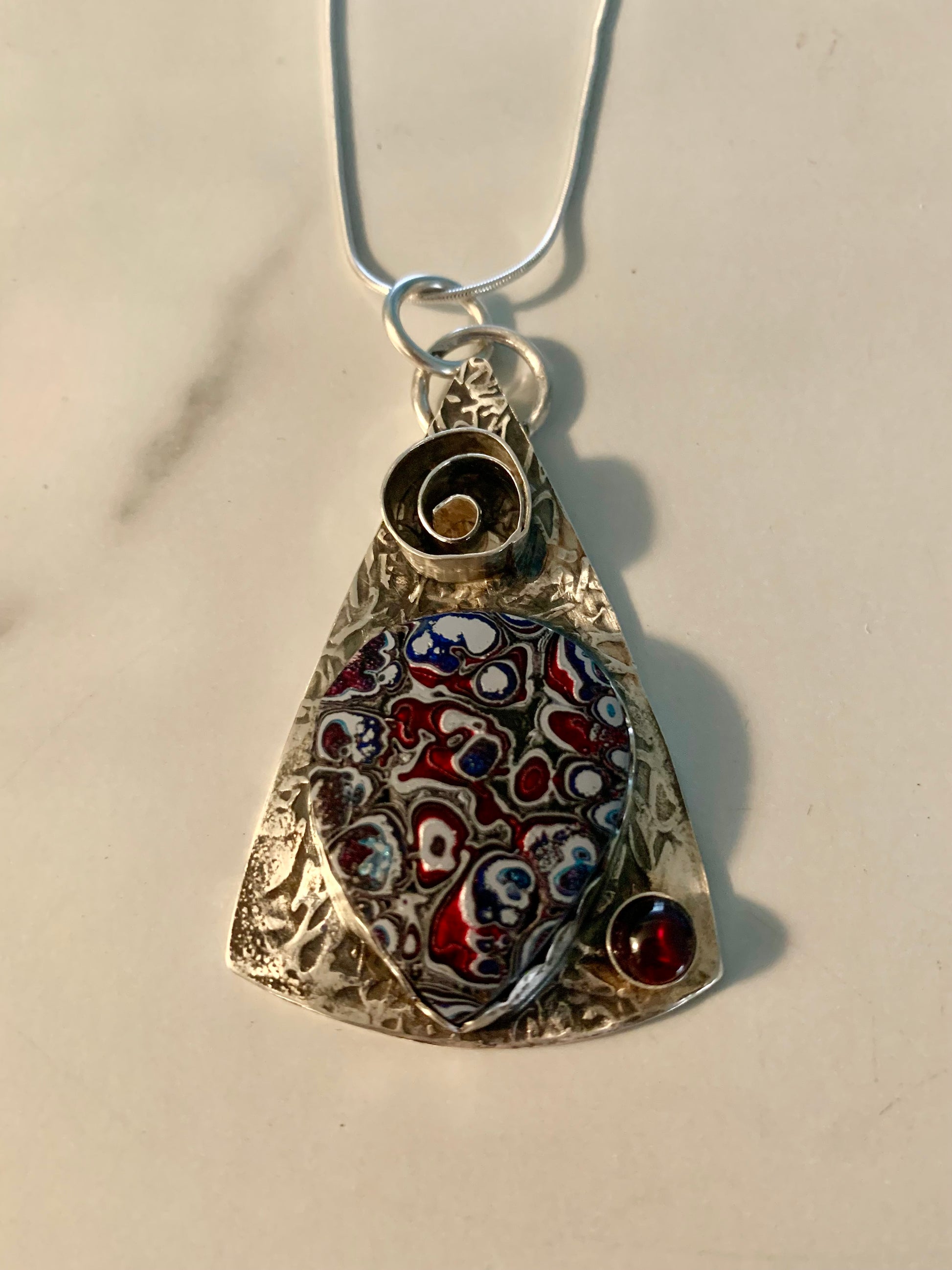 'Swirls Within' Fordite and Garnet Silver Pendant