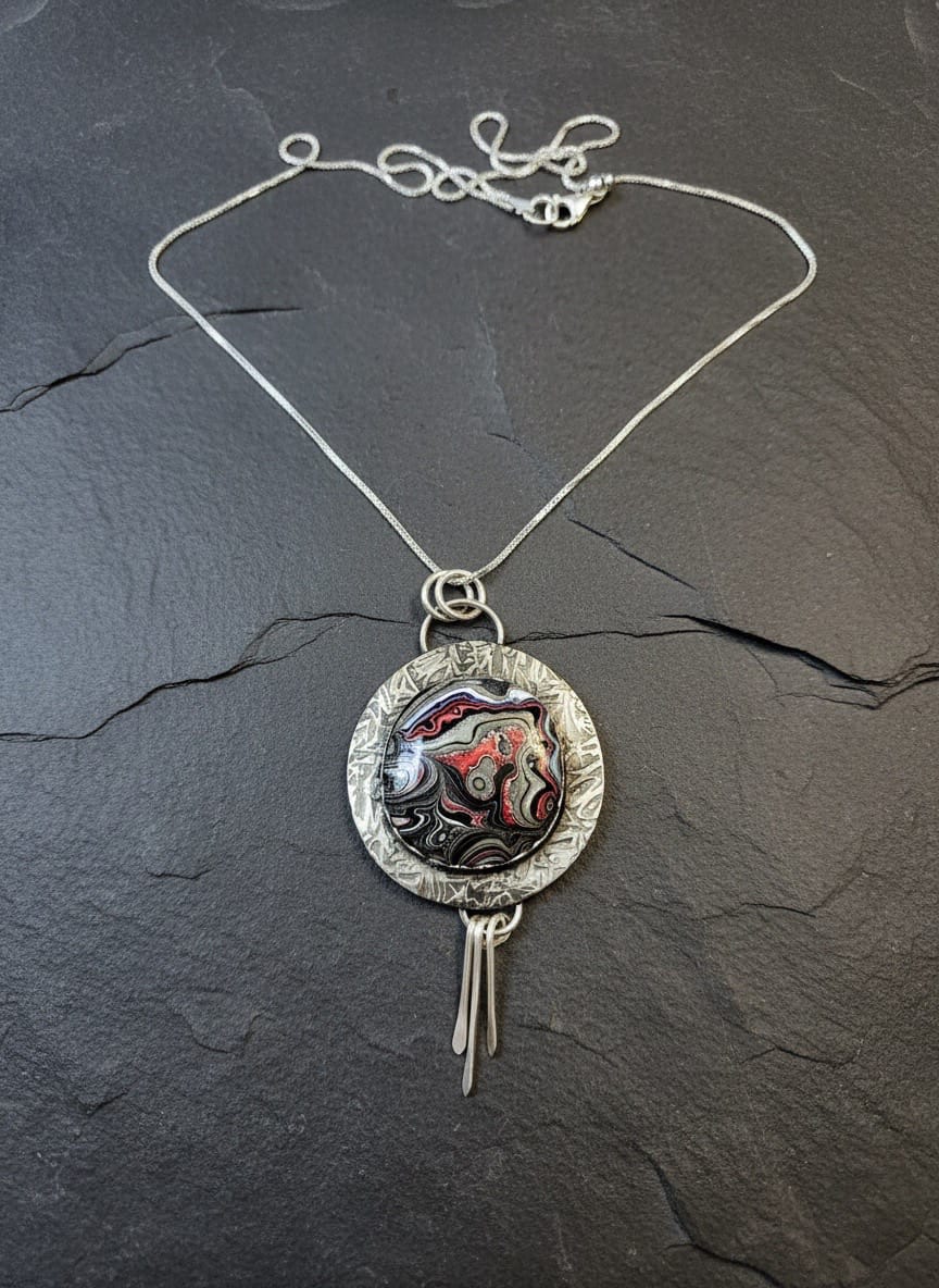 Painted by Time one-of-a-kind Fordite and sterling silver statement necklace handcrafted by Christine Keller.