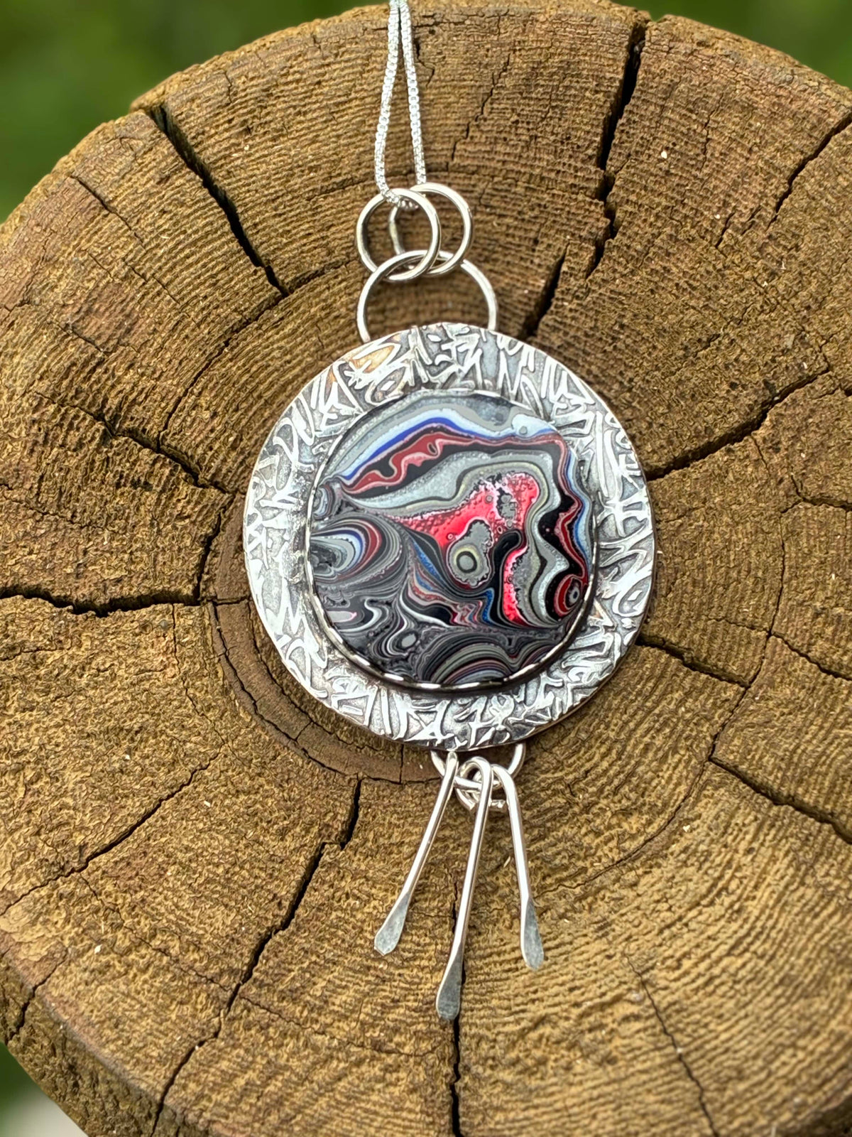 Painted by Time one-of-a-kind Fordite and sterling silver statement necklace handcrafted by Christine Keller.