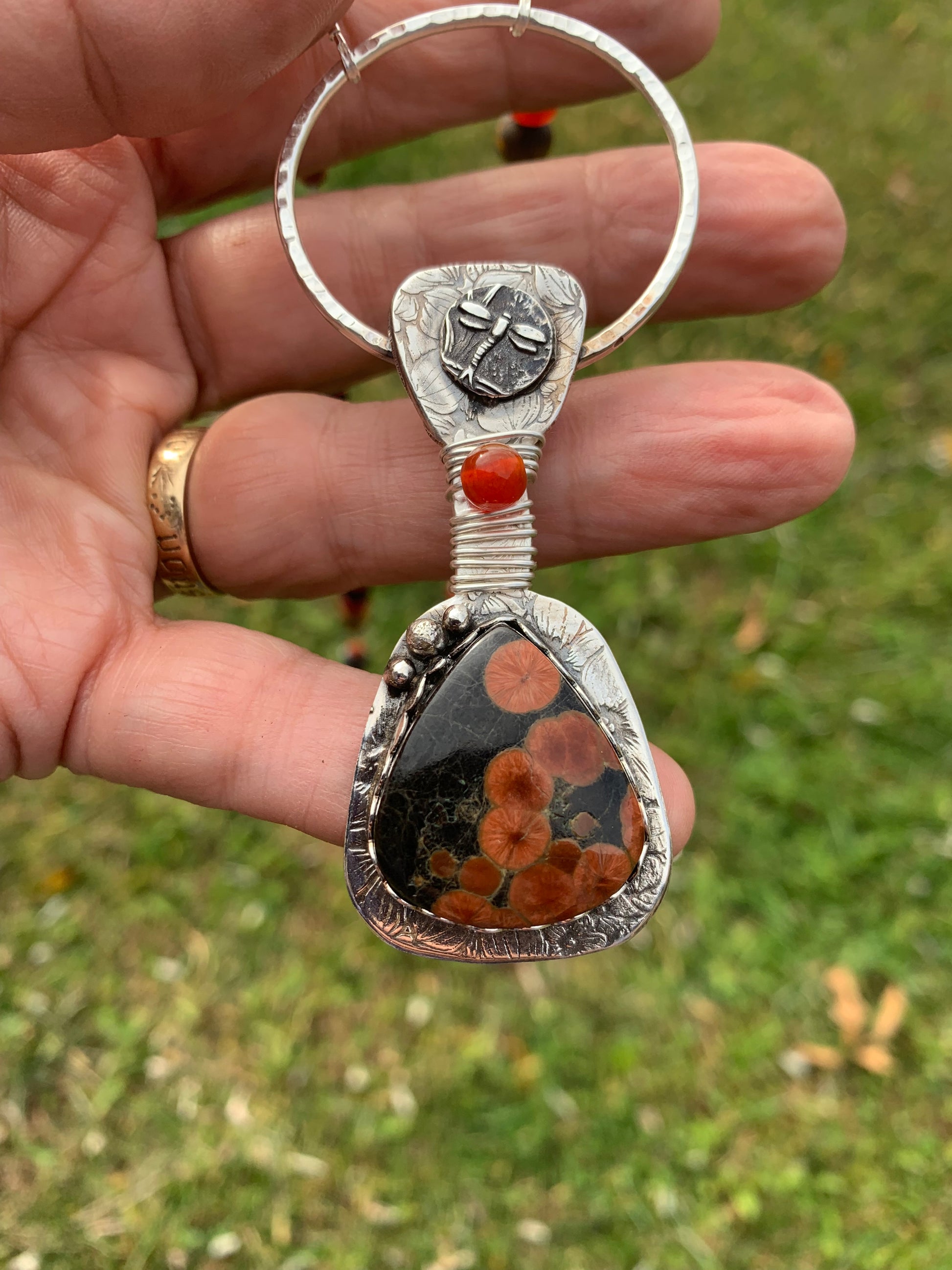 Poppy flowers in a stone, set in silver, handcrafted art jewelry