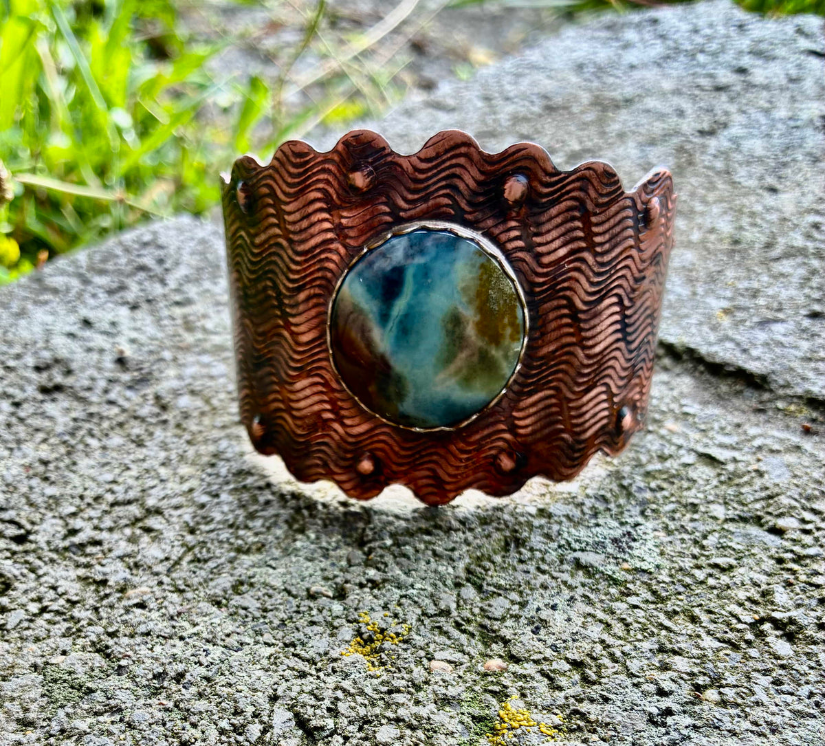 Riverstone handcrafted copper cuff bracelet featuring a natural Blue Wood Opal by Christine Keller.