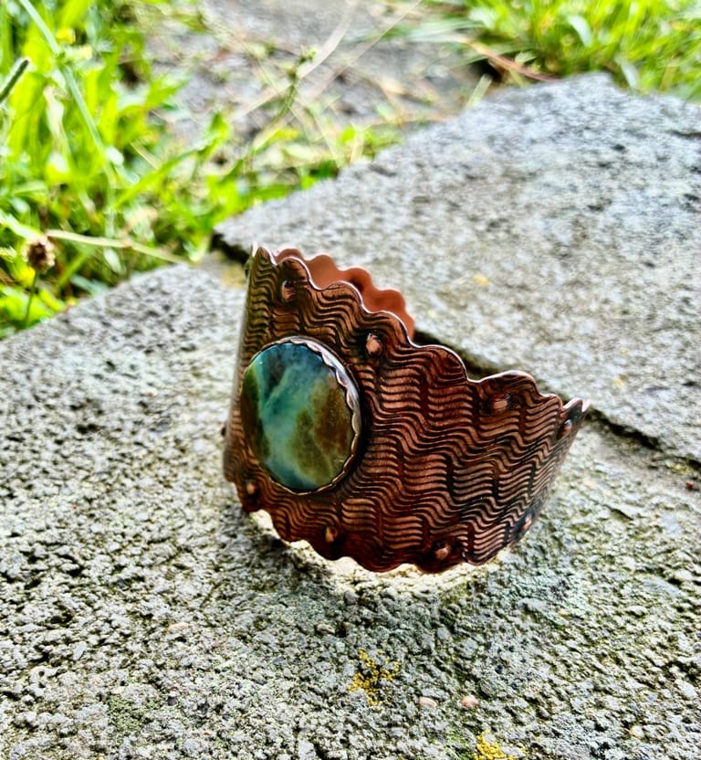Riverstone handcrafted copper cuff bracelet featuring a natural Blue Wood Opal by Christine Keller.