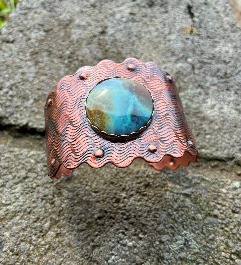 Riverstone handcrafted copper cuff bracelet featuring a natural Blue Wood Opal by Christine Keller.