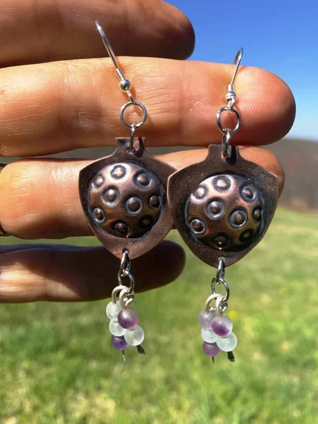 Round and Round earrings with copper and bead details