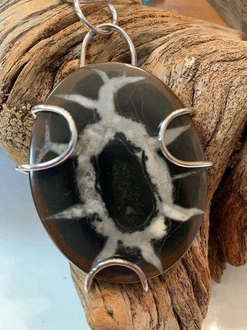 Septarian pendant with unique white pattern and silver wire wrap