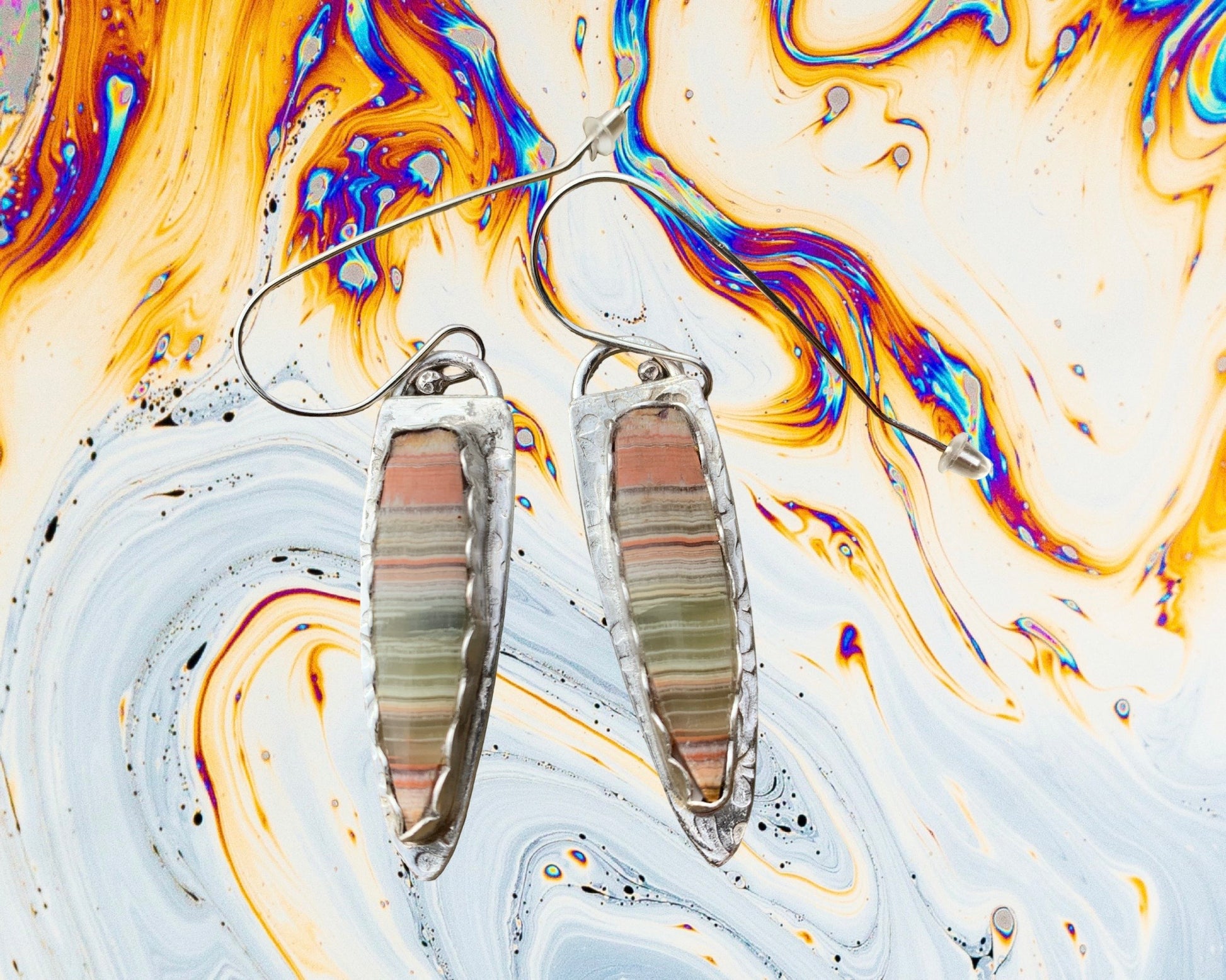 Striped Green Onyx earrings on colorful background
