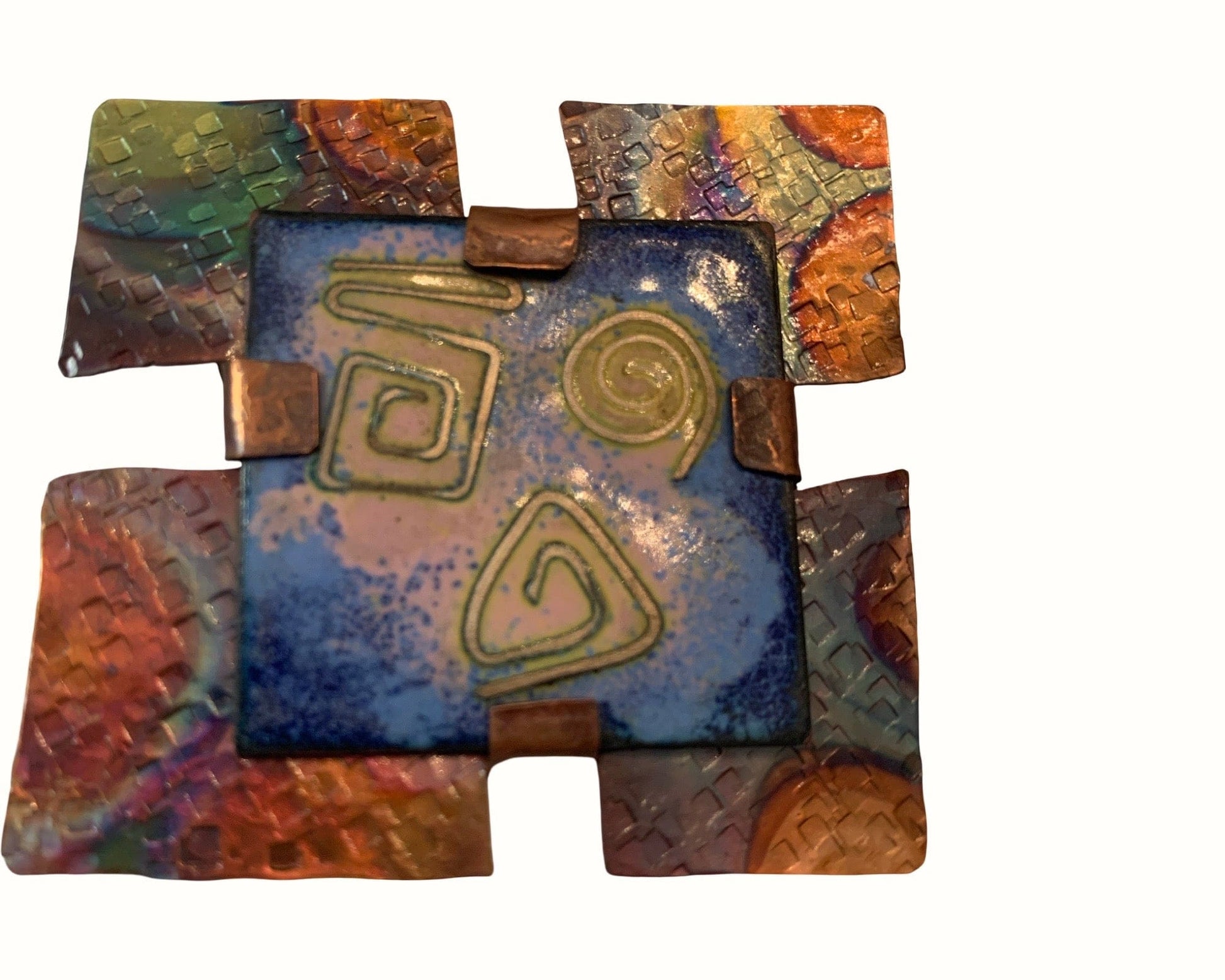 Decorative copper enamel Brooch with geometric patterns on a white background