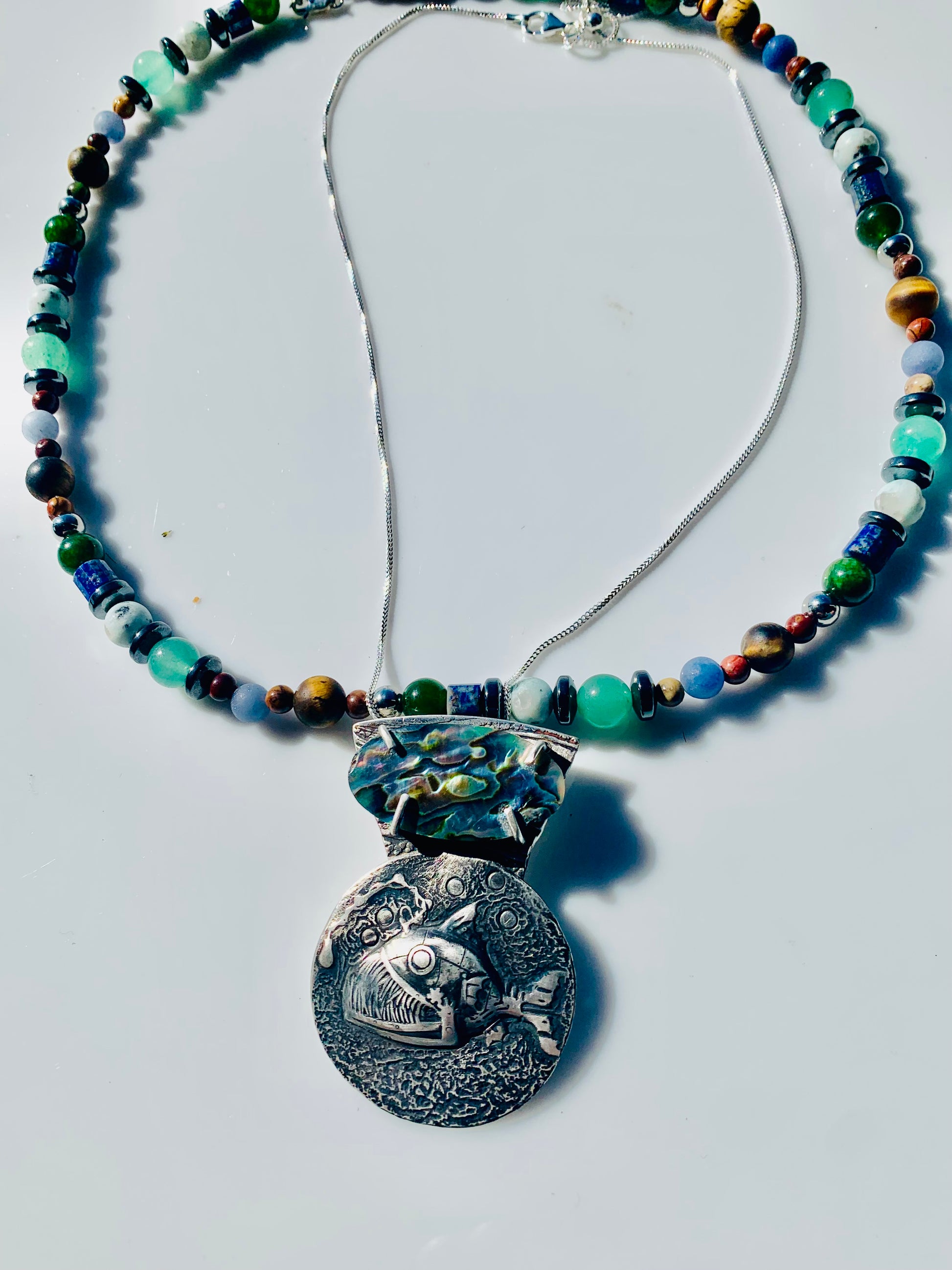 Twinkle necklace with fish pendant and beaded necklace