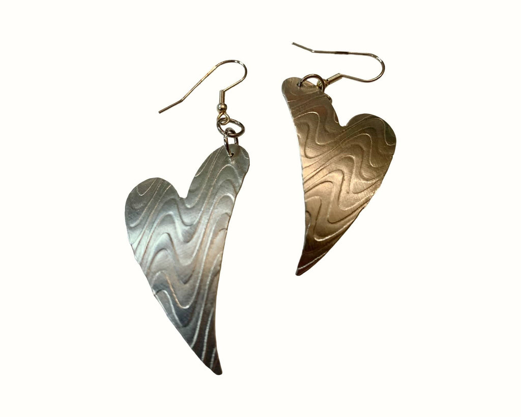 Heart-shaped earrings with wavy patterns on a white background
