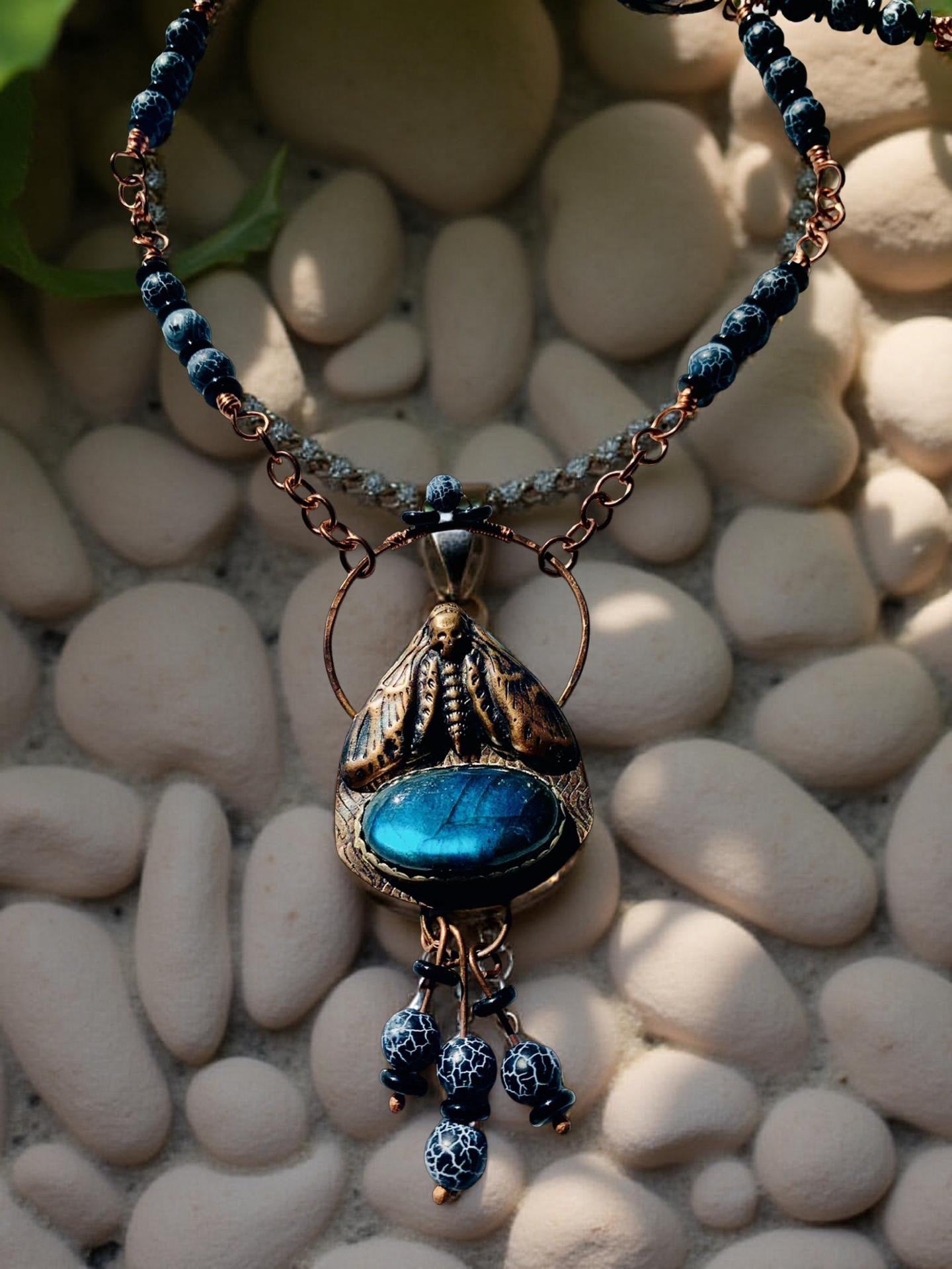 Deadhead moth necklace with blue gemstone