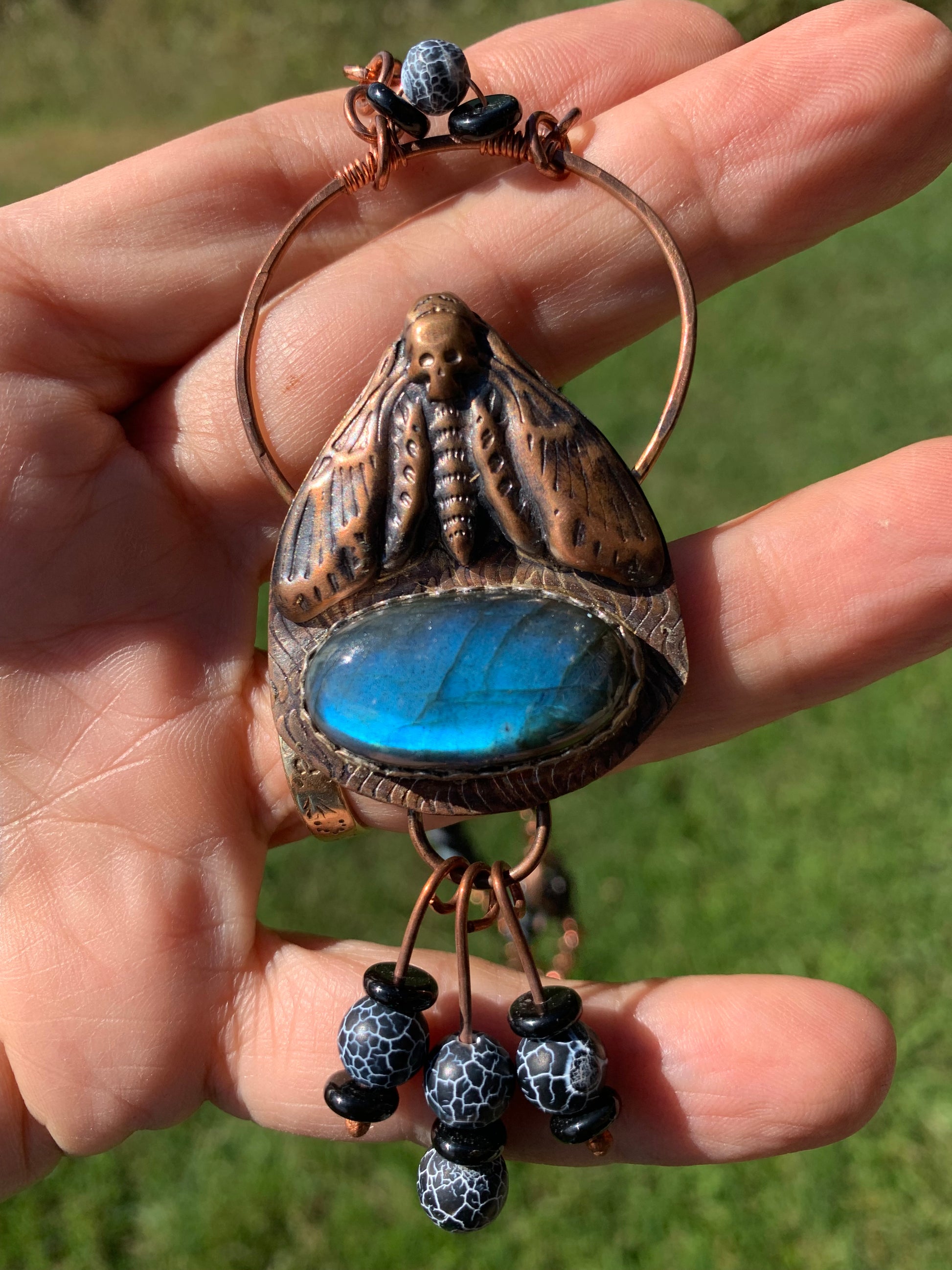Deadhead moth pendant with blue gemstone